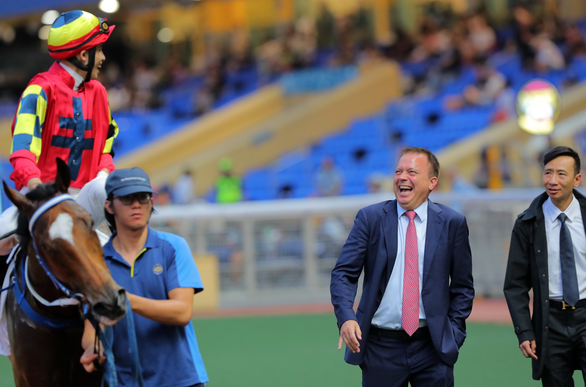 Ellis Wong (left) and Caspar Fownes are all smiles at Happy Valley on Wednesday.