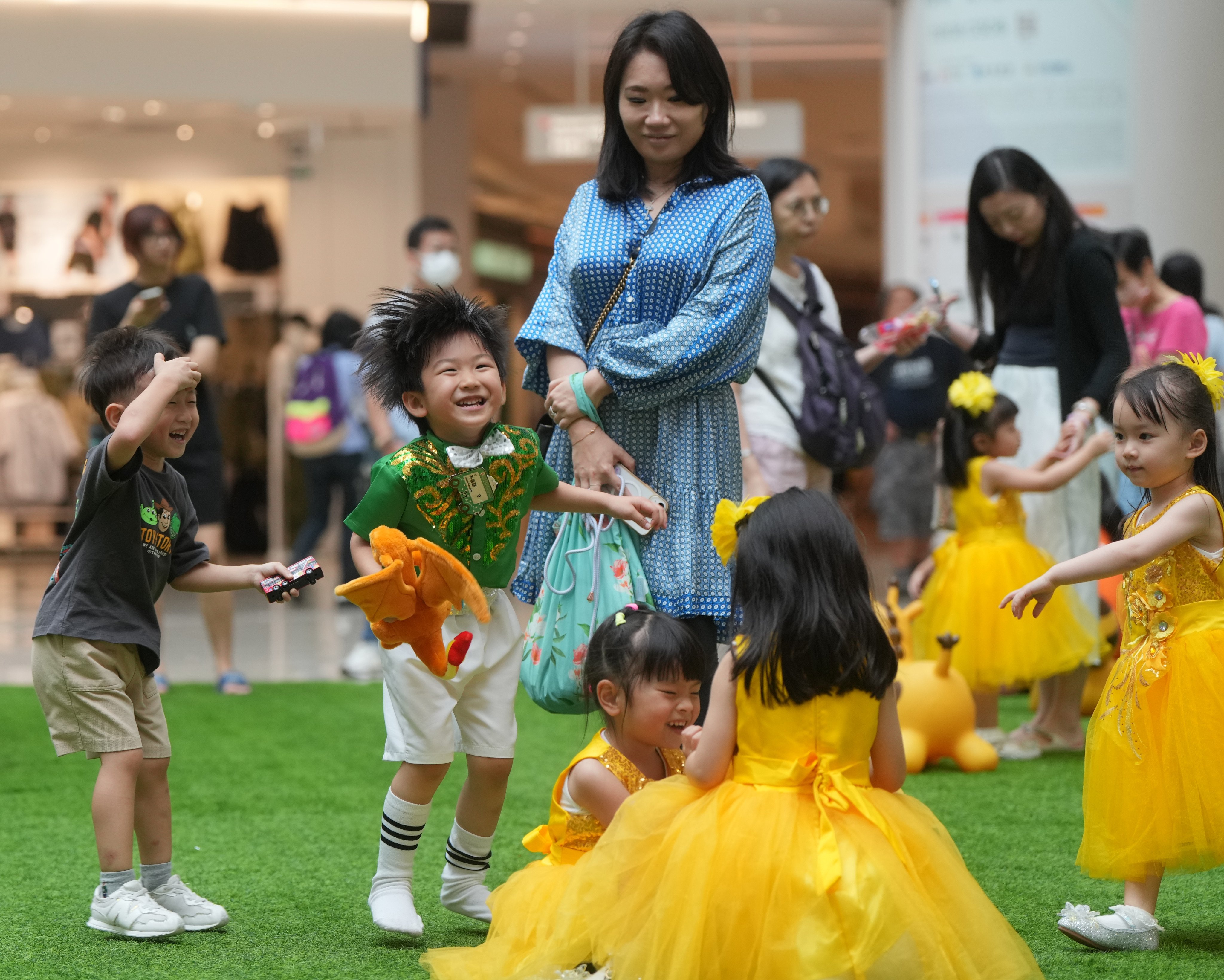 Children play in an open area at Olympian City at Tai Kok Tsui. The online poll of 4,529 residents was aimed at gauging the happiness level of families in the post-pandemic era. Photo: Sam Tsang
