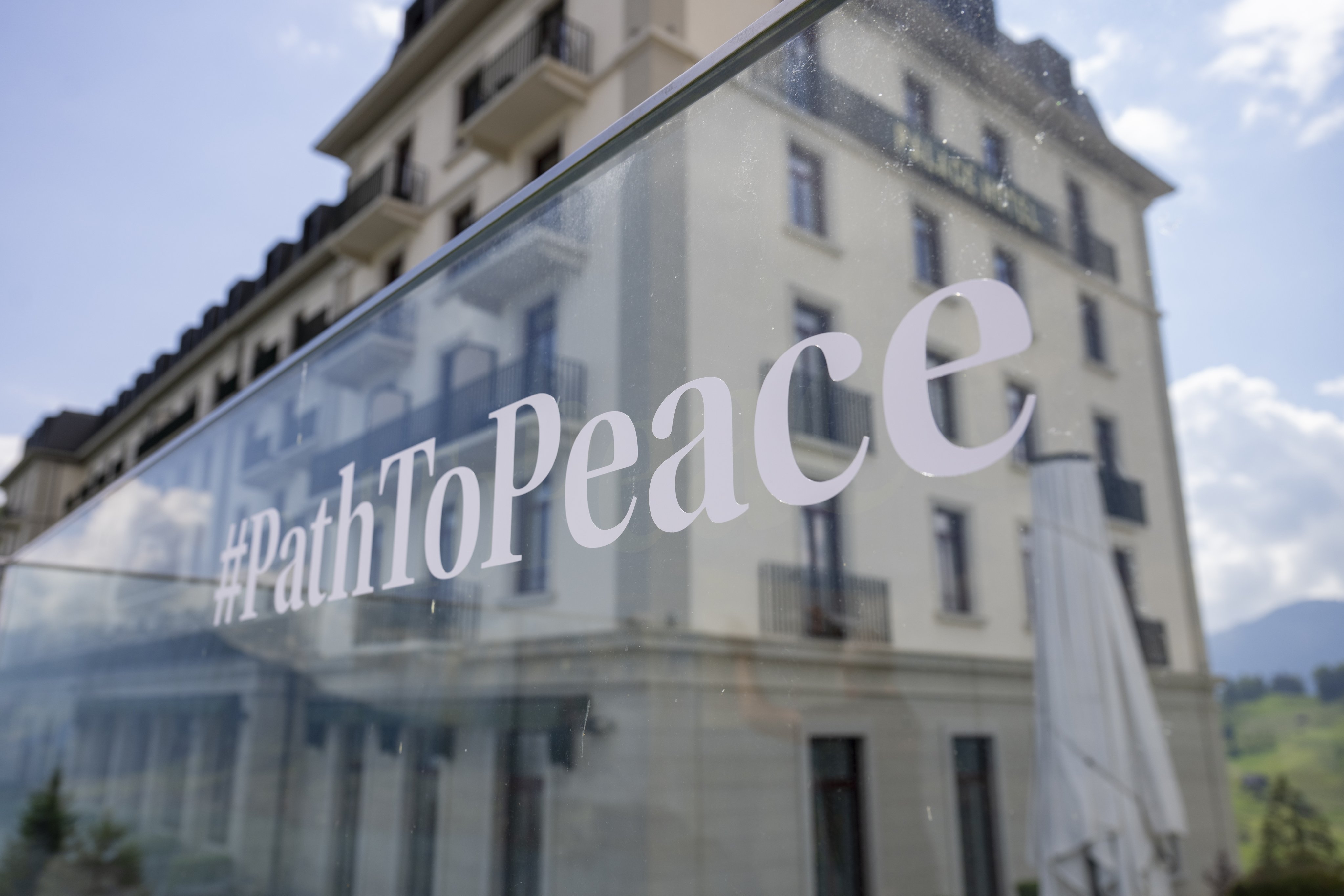 The hashtag #PathToPeace is pasted on the glass panel of a balustrade in front of a resort building as final preparations are done for the “Summit on Peace in Ukraine” in Switzerland. Photo: EPA-EFE