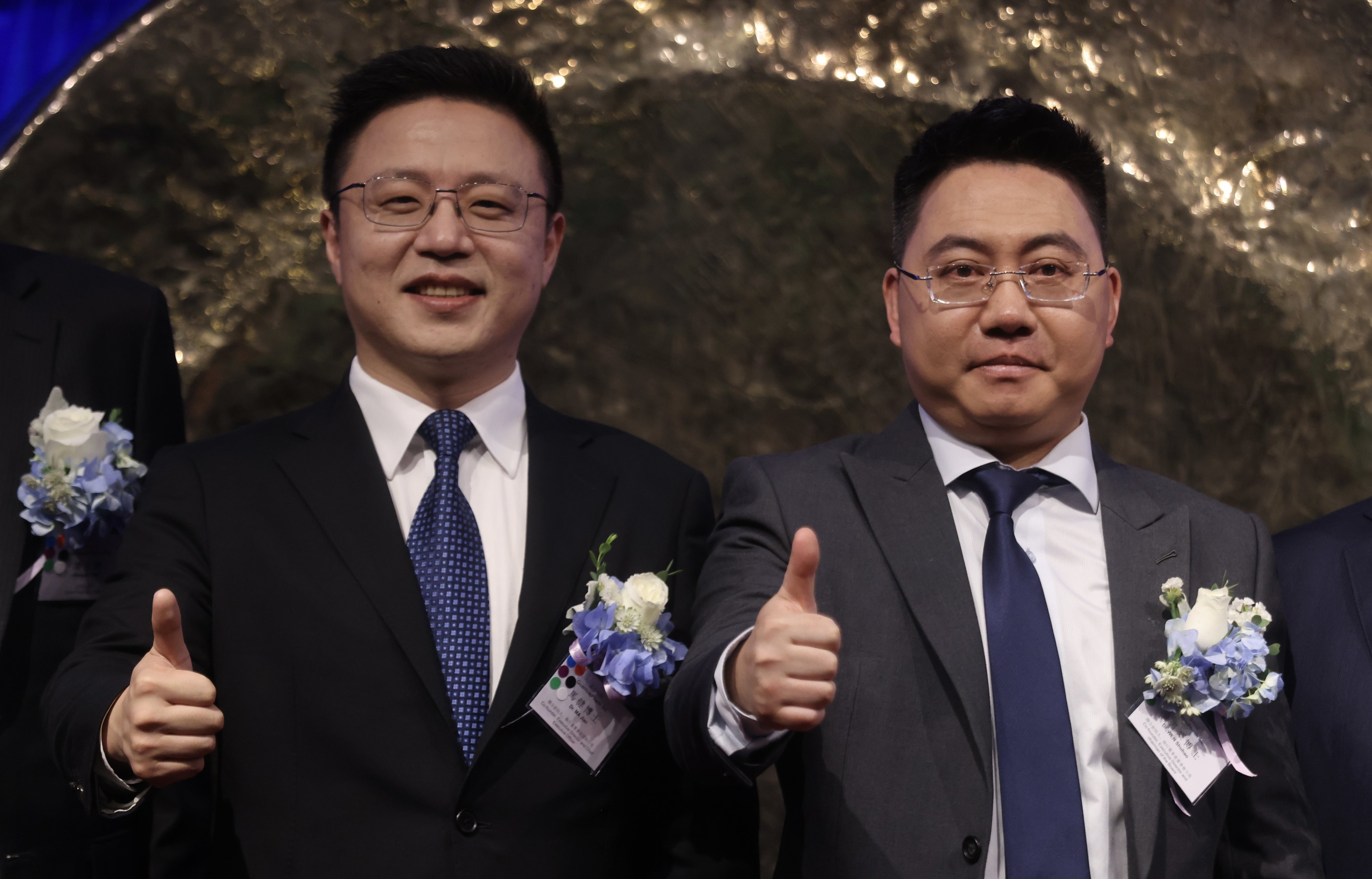 QuantumPharm co-founder Ma Jian, left, and Wen Shuhao, at the company’s listing ceremony on Thursday. Photo: Jonathan Wong