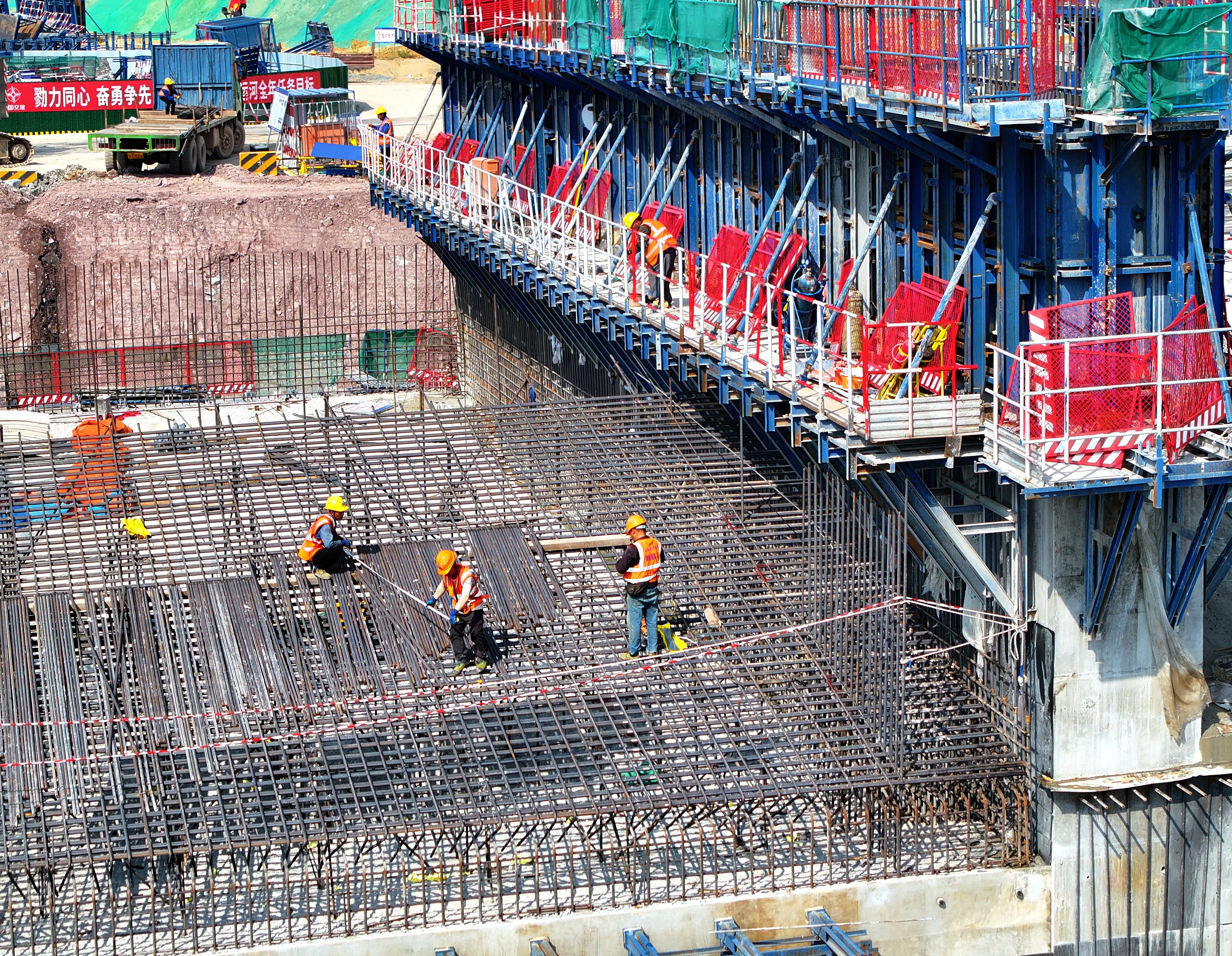 Workers are seen building a 134km canal in China’s Guangxi Zhuang autonomous region in October, at a cost of 72.7 billion yuan. Large-scale infrastructure projects across the country have put many local regions heavily in debt.  Photo: Xinhua