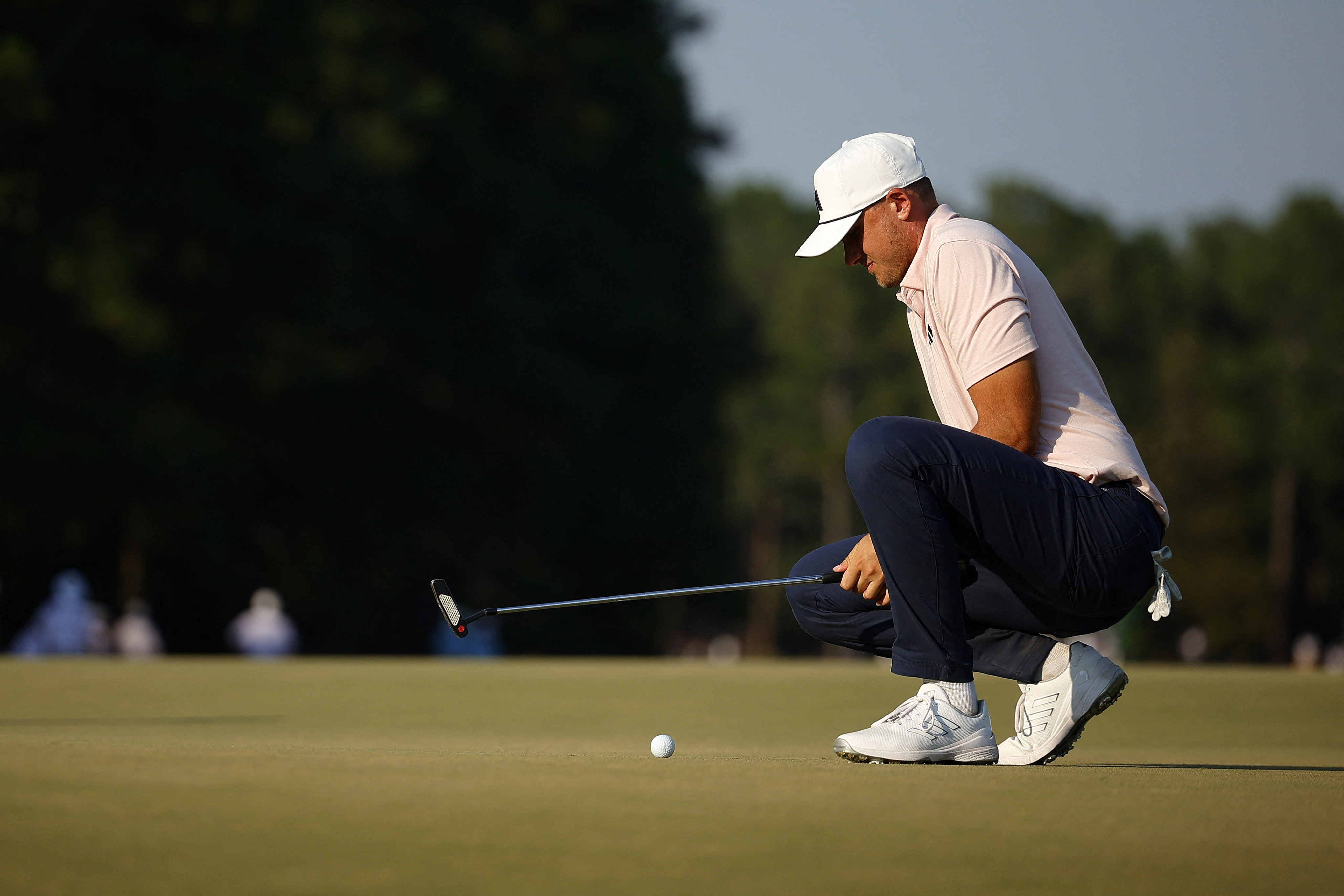 Tournament leader Ludvig Aberg of Sweden lines up a putt on the 18th green in the second round of the US Open at Pinehurst Resort on Friday. Photo: AFP