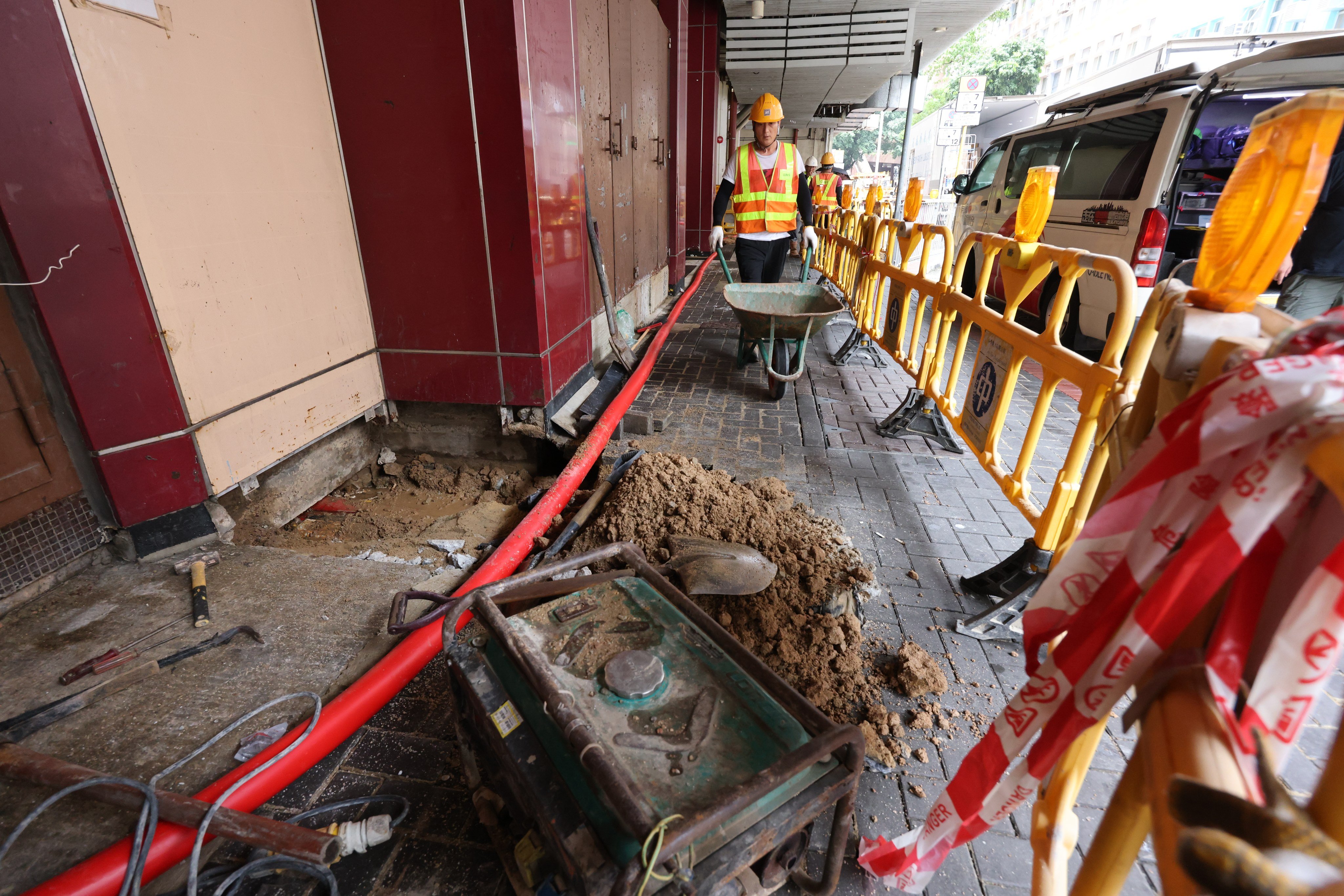 CLP Power workers carry out maintenance outside Lung Kwong House, in Lower Wong Tai Sin Estate, on June 13. The power company said a fault in an 11,000-volt underground cable in Wong Tai Sin caused power supply disruptions that left many customers in the dark. Photo: Jelly Tse