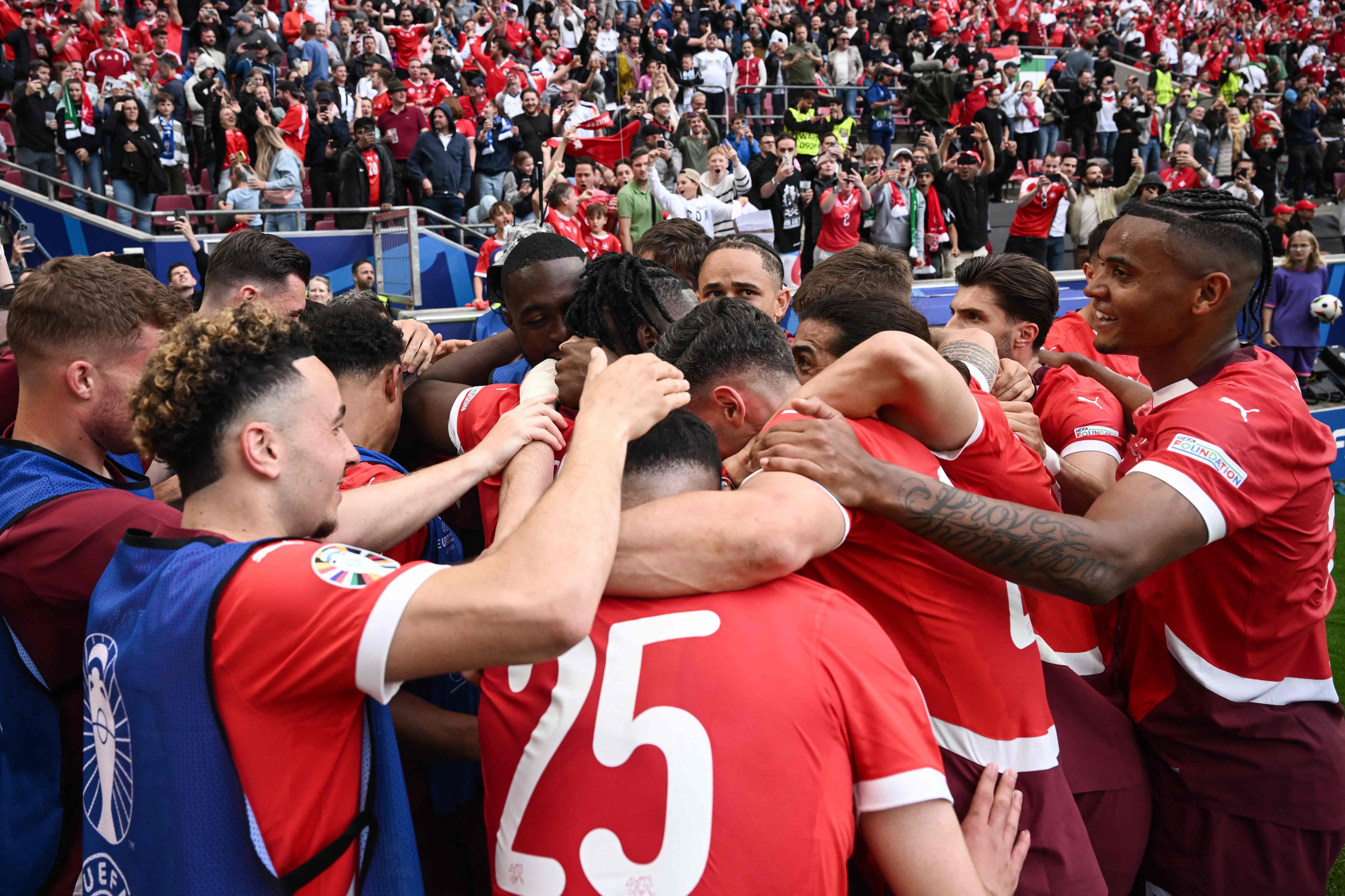 Switzerland players celebrate with Breel Embolo after his goal clinched a 3-1 win over Hungary. Photo: AFP