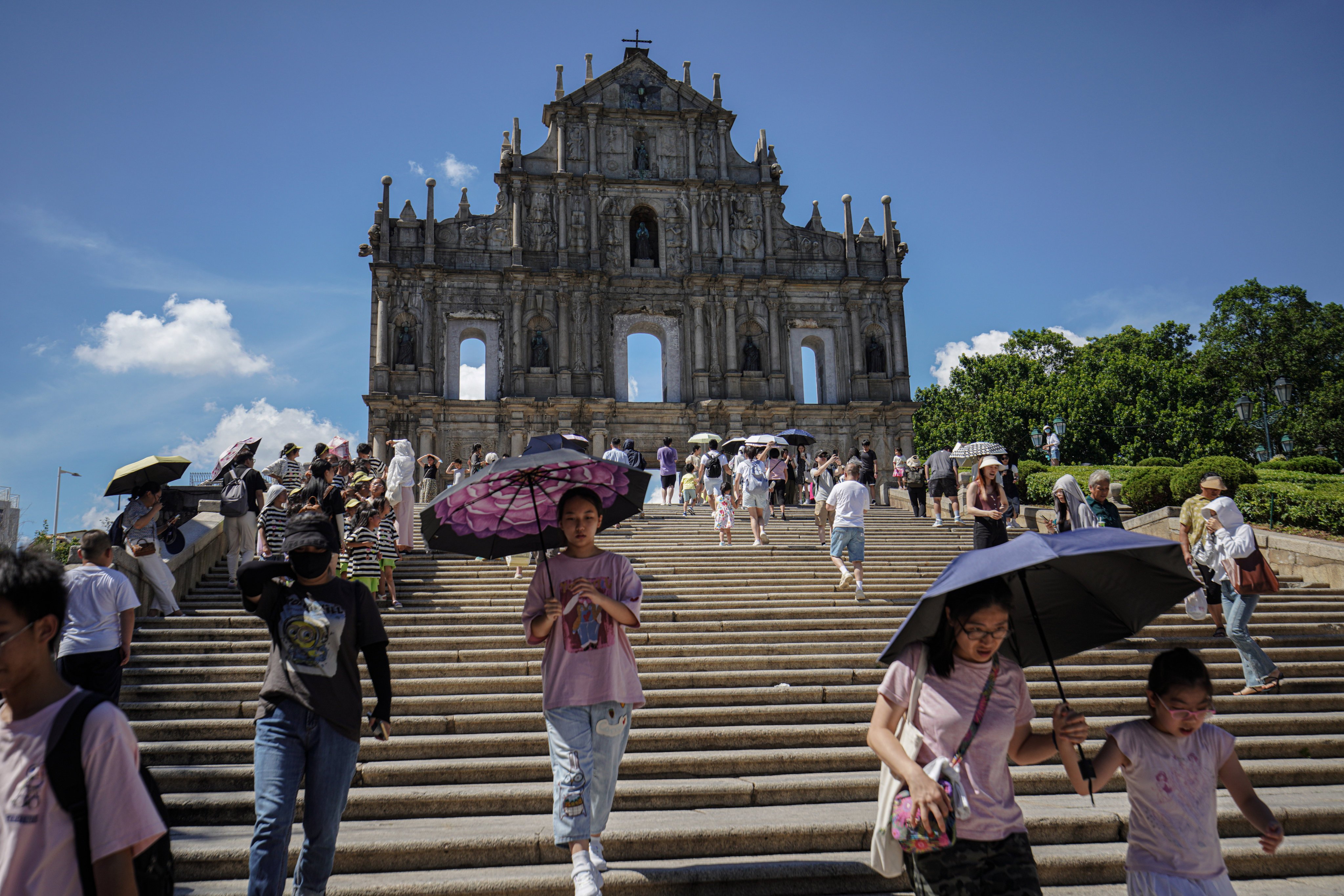 Tourists visit the Ruins of St Paul’s in Macau. “Hong Kong has always been a ‘big brother’ to Macau,” the city’s leader told members of the media on Monday. Photo: Getty Images