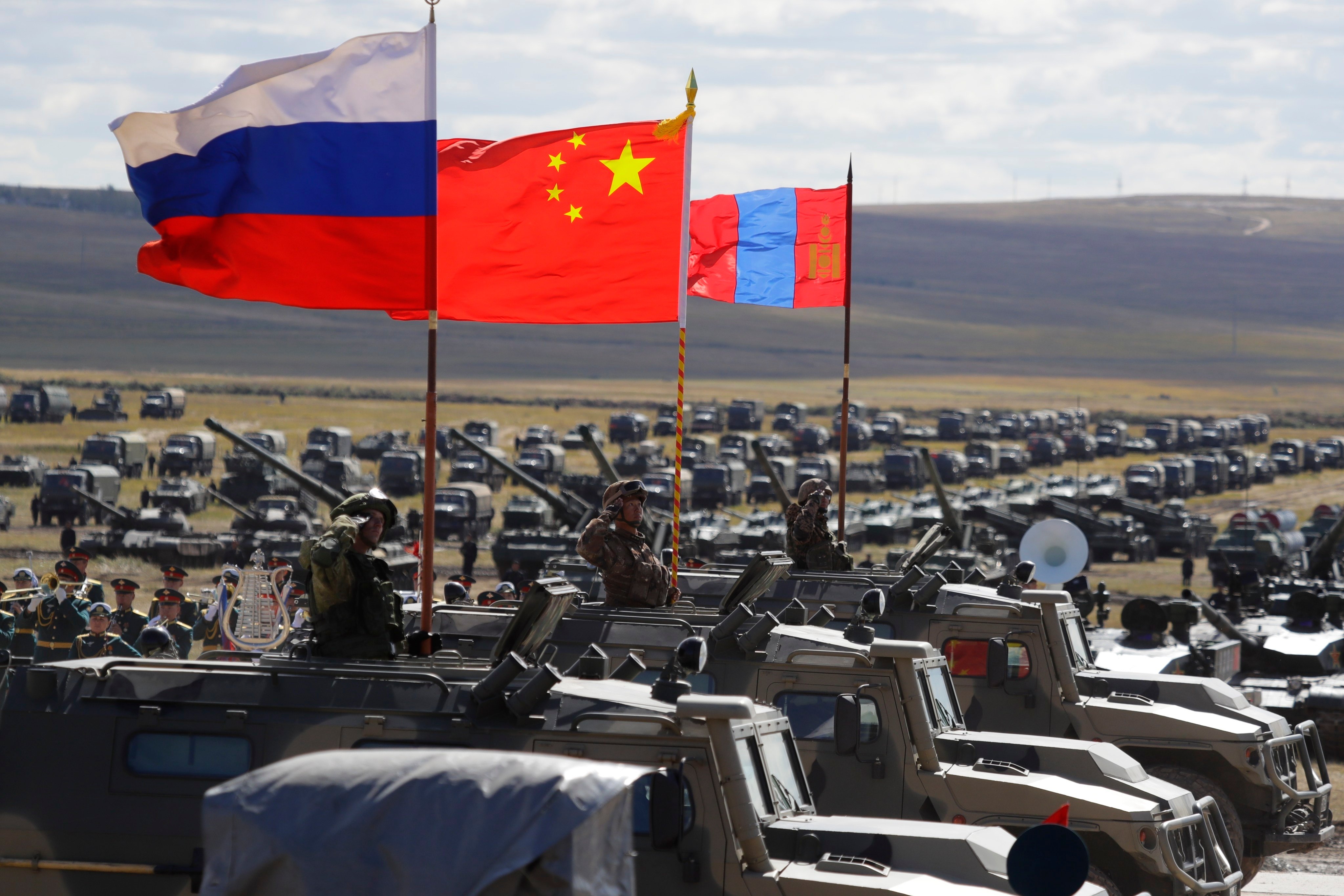 From left, Russian, Chinese and Mongolian flags. A Mongolian opposition candidate was beaten to death, authorities said. Violence during election campaigns is rare in the democratic country sandwiched between China and Russia. Photo: AP