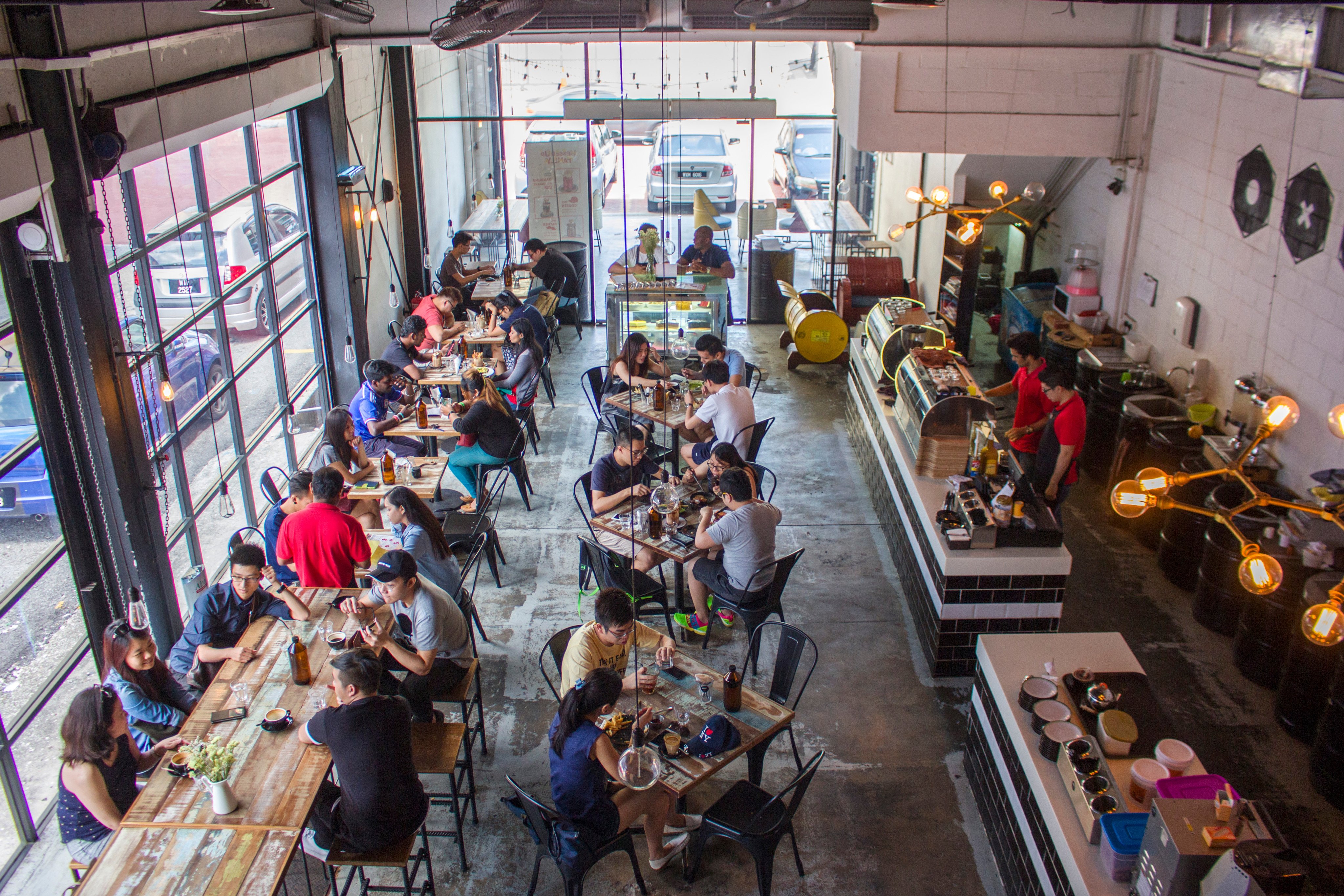 People dine in a restaurant in Kuala Lumpur. Malaysian businesses are warning they may have to pass on rising costs to customers. Photo: Shutterstock