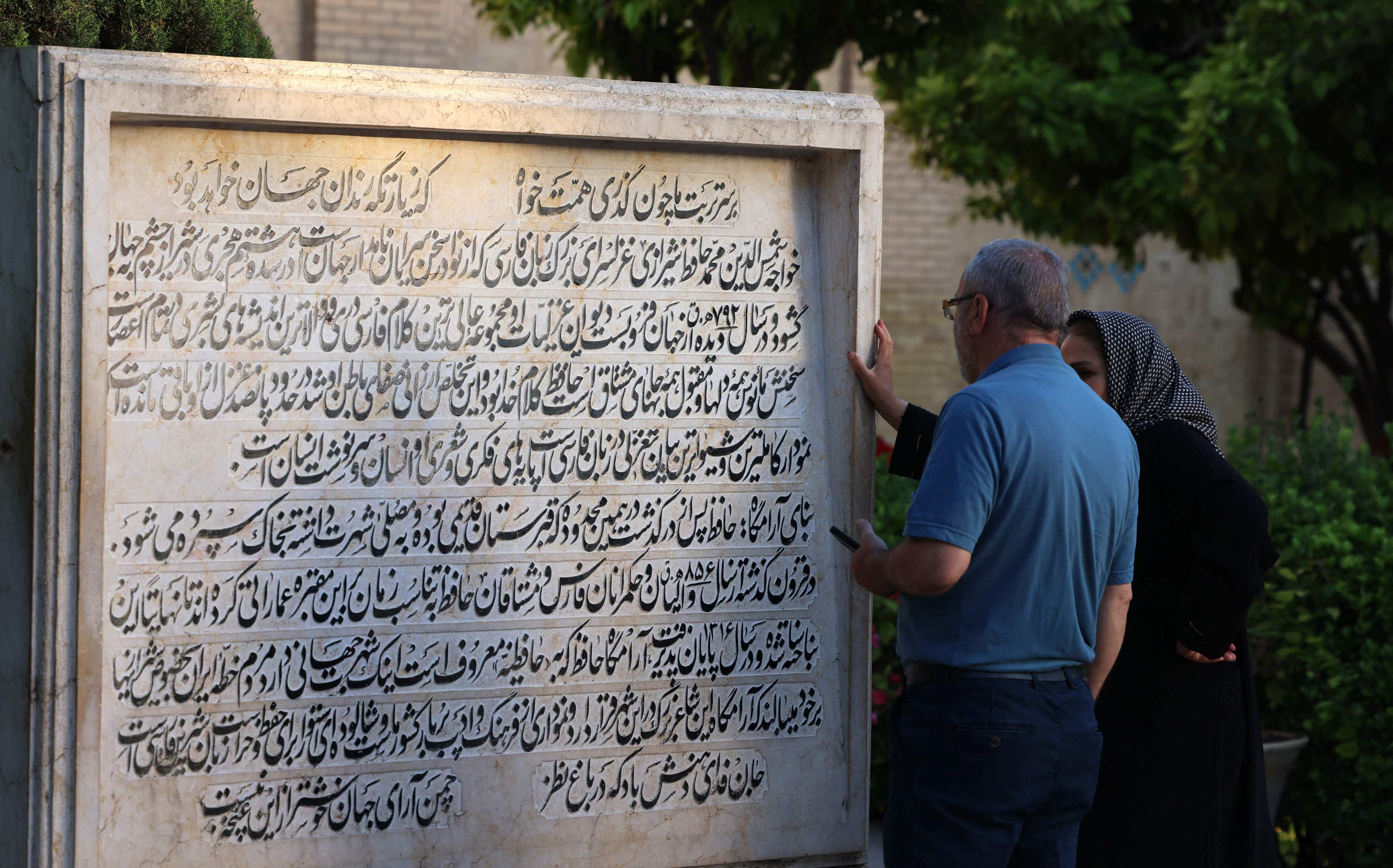 Iranians at the tomb of Persian poet Hafez, in Shiraz, Iran, where he lived and died in the 14th century. The bard’s works are a source of guidance for many in Iran, and are commonly used in fortune-telling. Photo: AFP