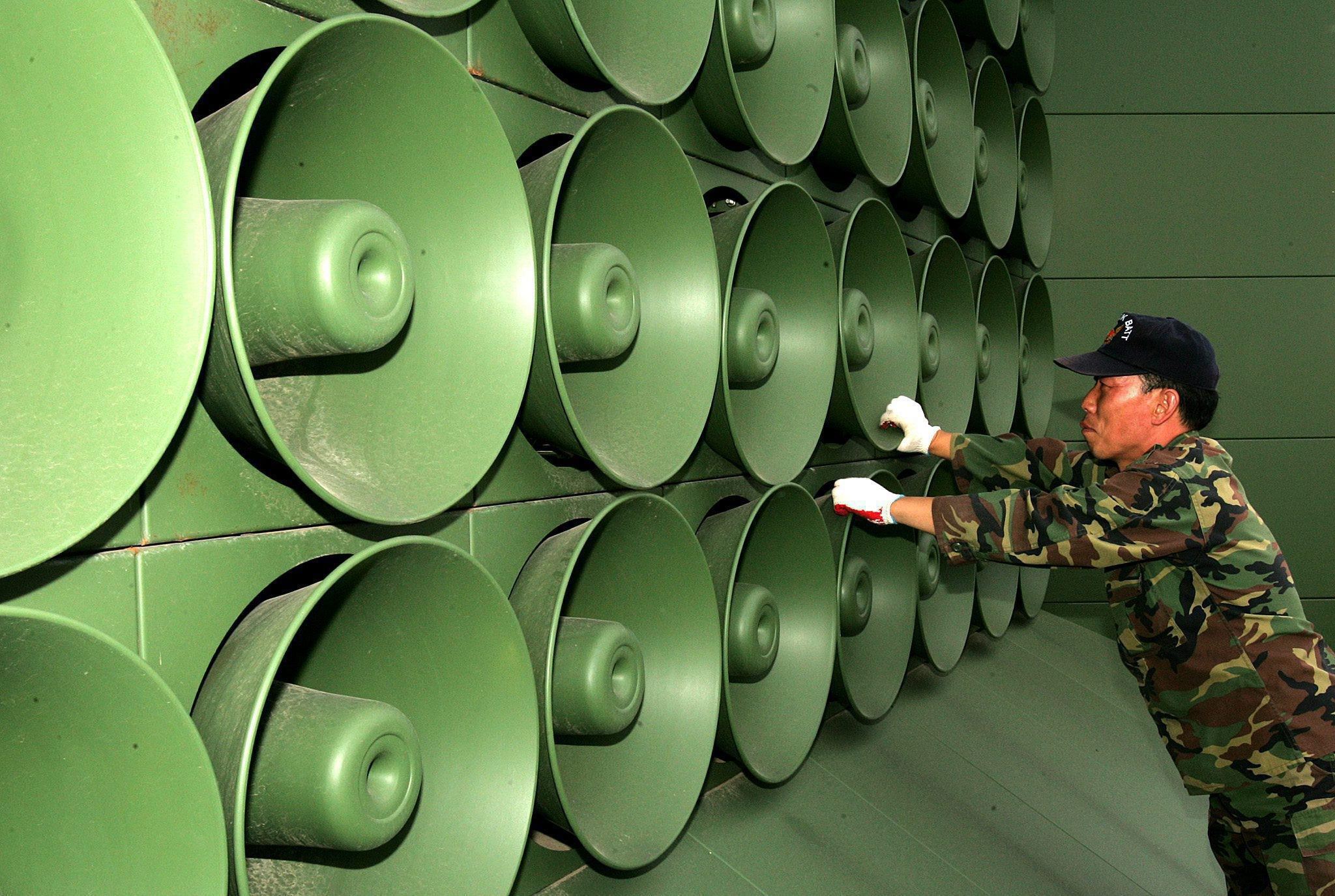 A South Korean soldier adjusts propaganda loudspeakers in the Demilitarized Zone. The current speakers, which date to 2016, aren’t as powerful as the military wanted. Photo: EPA-EFE