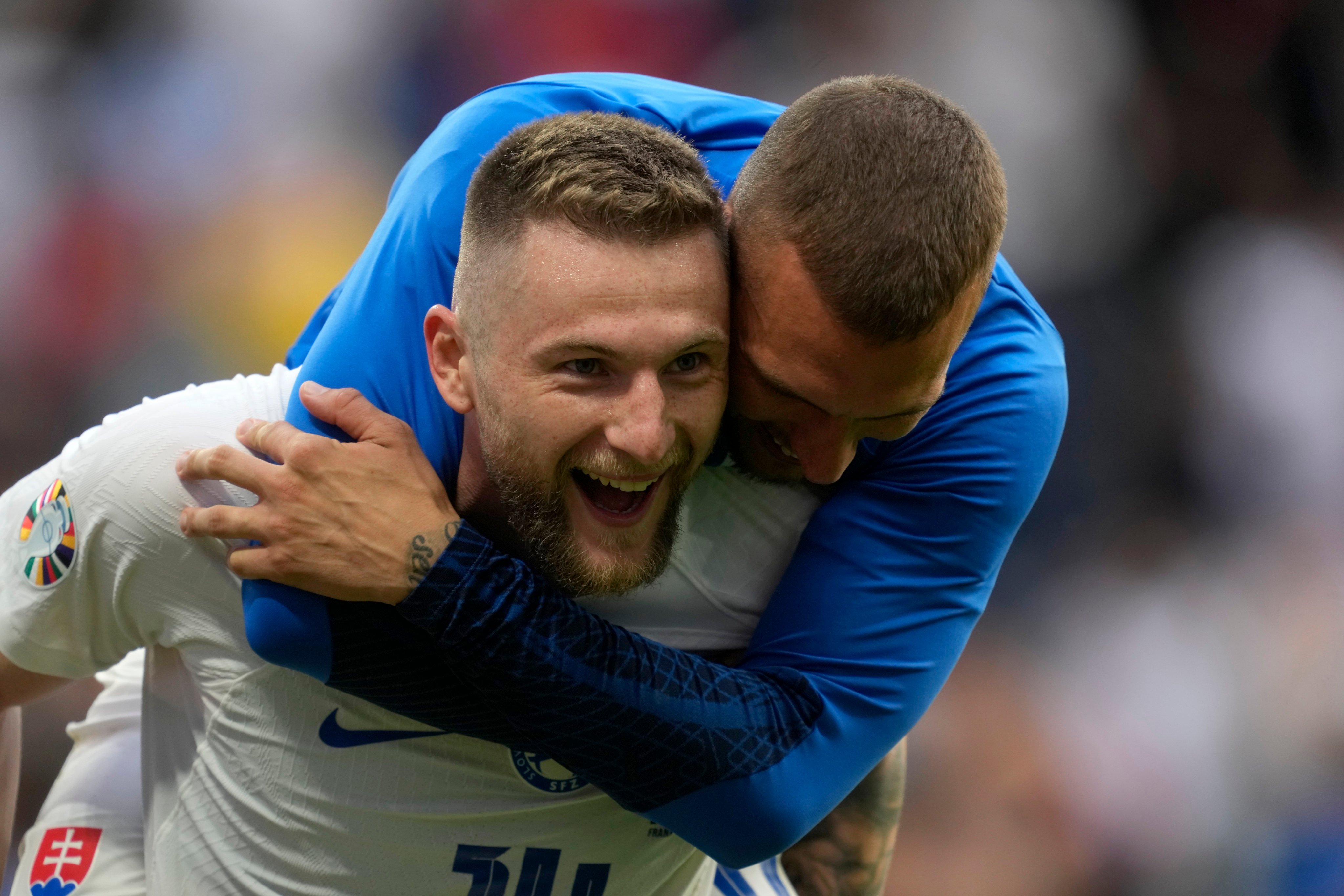 Slovakia’s Milan Skriniar, left, celebrates after the Group E match against Belgium at the Euro 2024 in Frankfurt, Germany on Monday. Photo: AP