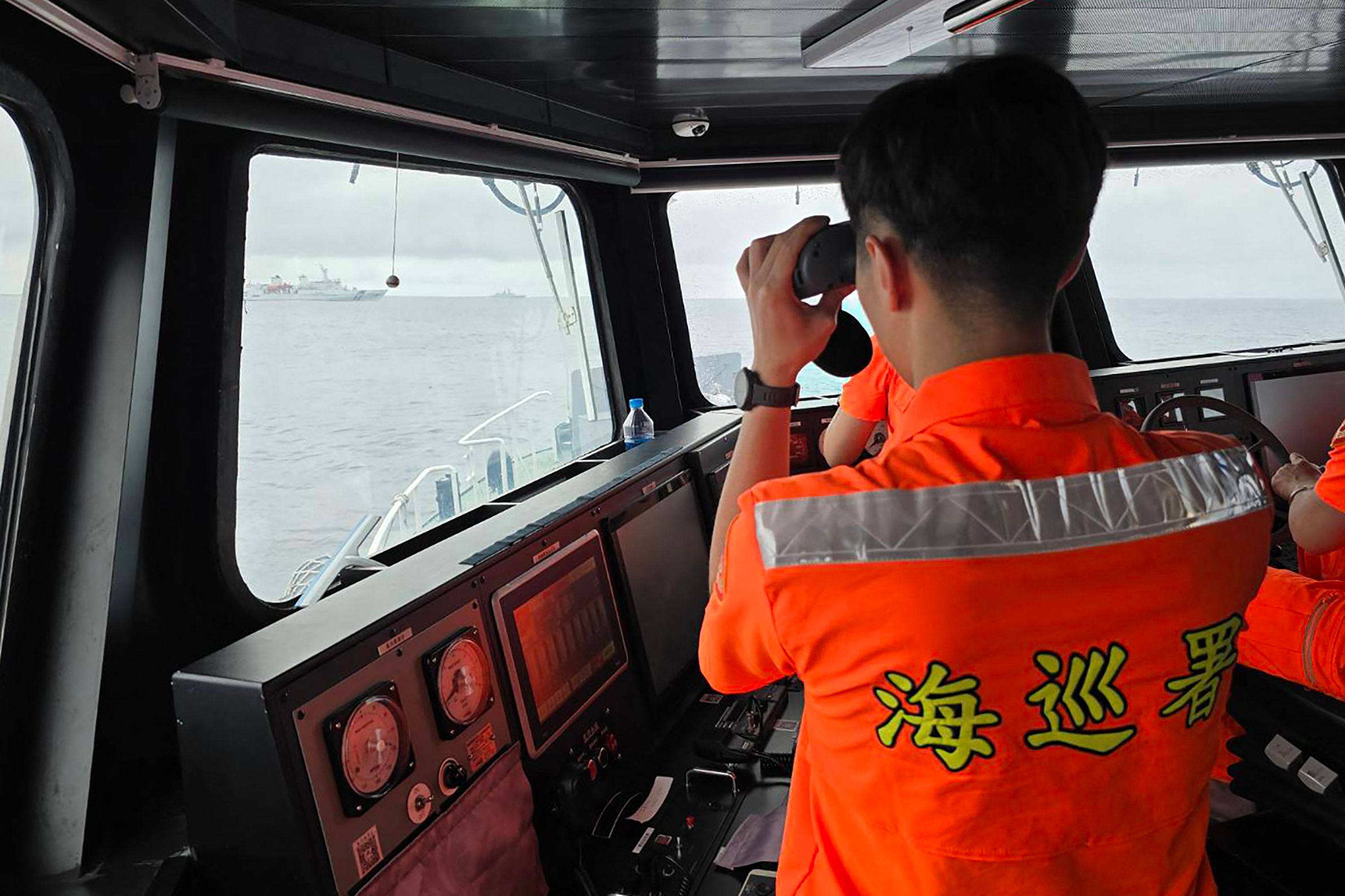 Taiwanese armed forces monitoring a Chinese military ship (R) as it sails a few miles north of Pengjia Island, off the coast of northern Taiwan, on May 23. Photo: Handout