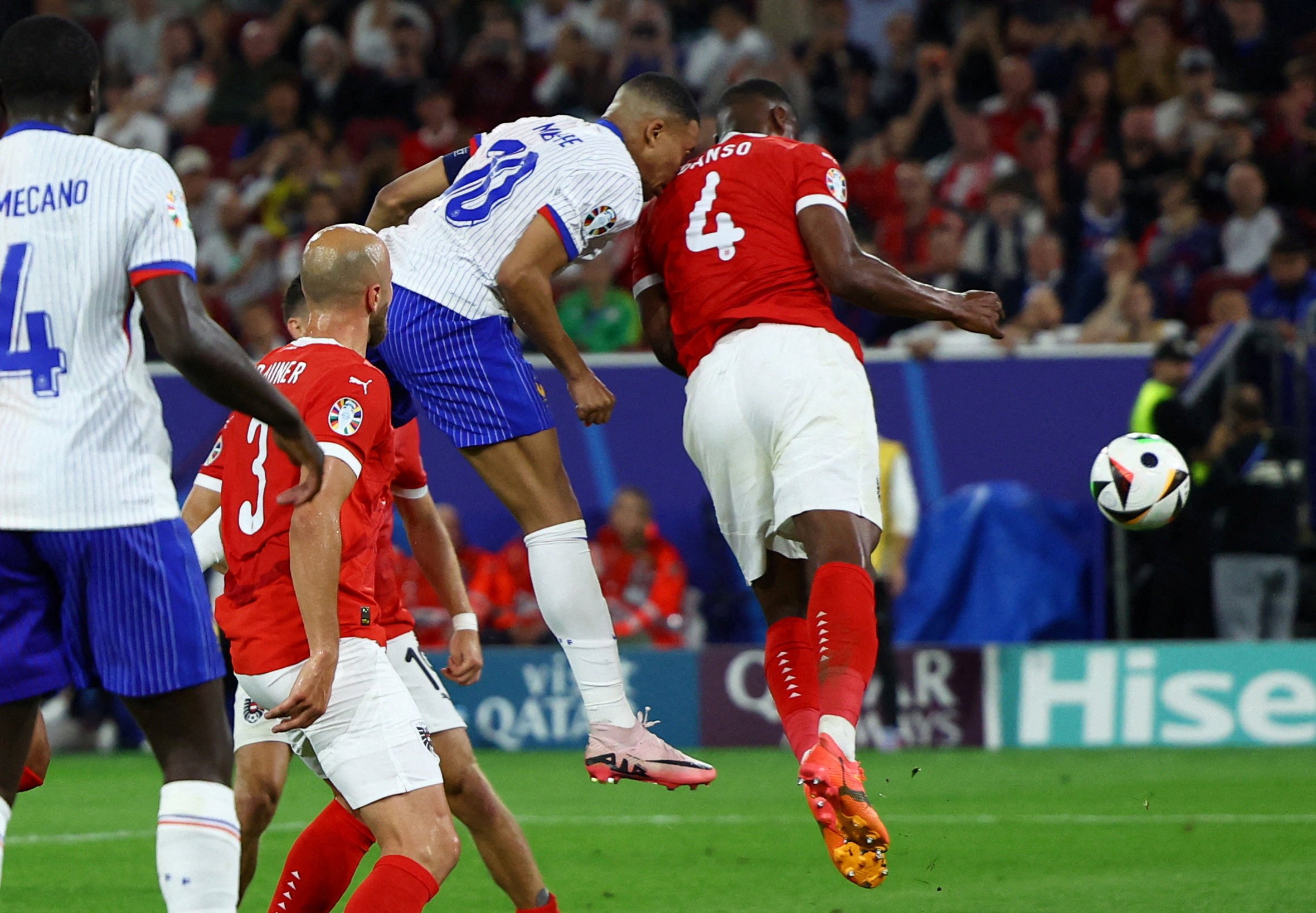 France’s Kylian Mbappé collides with Austria’s Kevin Danso during the Group D match between France and Austria on Monday. Photo: Reuters