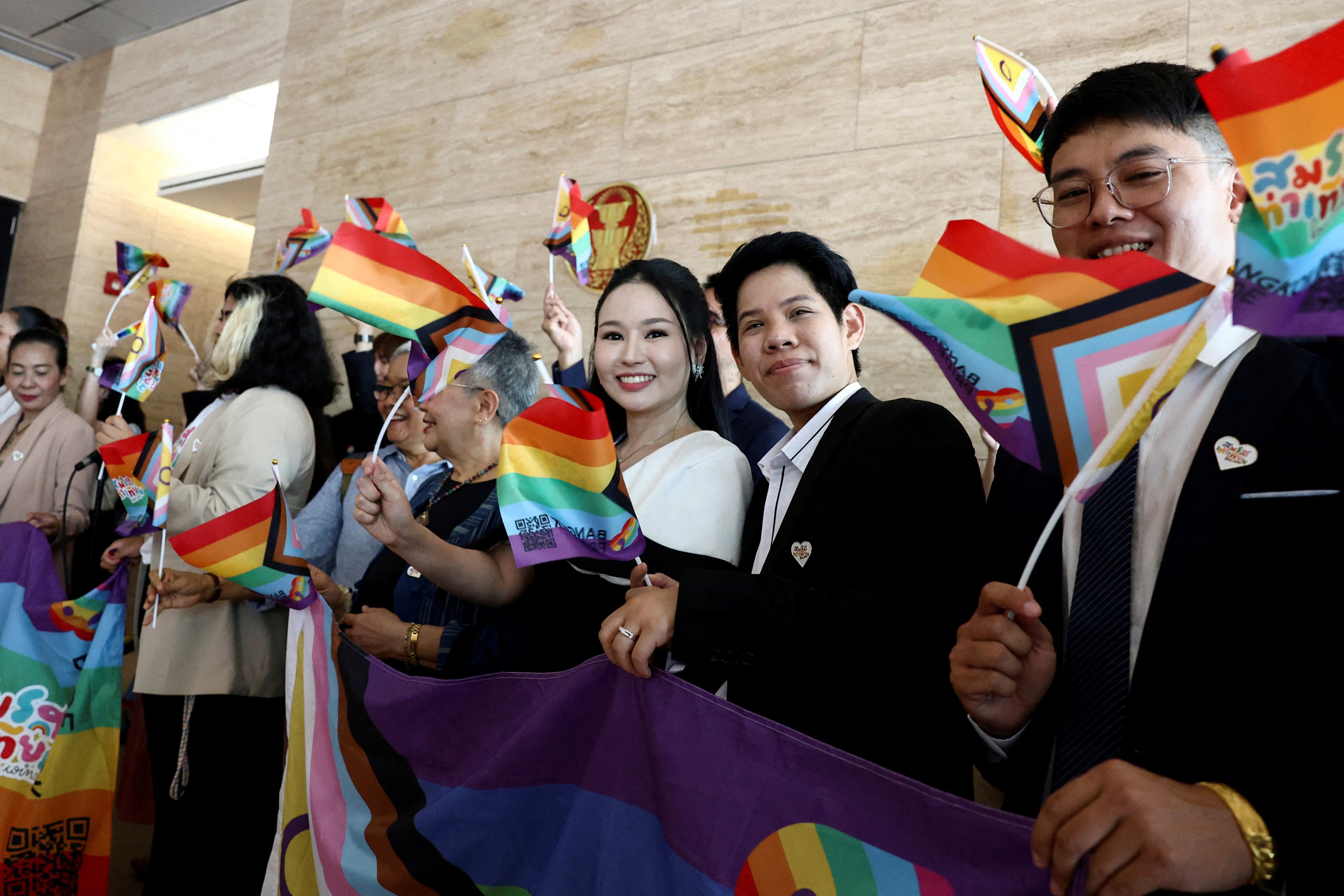 Members of Thailand’s LGBTQ community arrive ahead of the passing of the marriage equality bill in its second and third readings by the Senate. Photo: Reuters