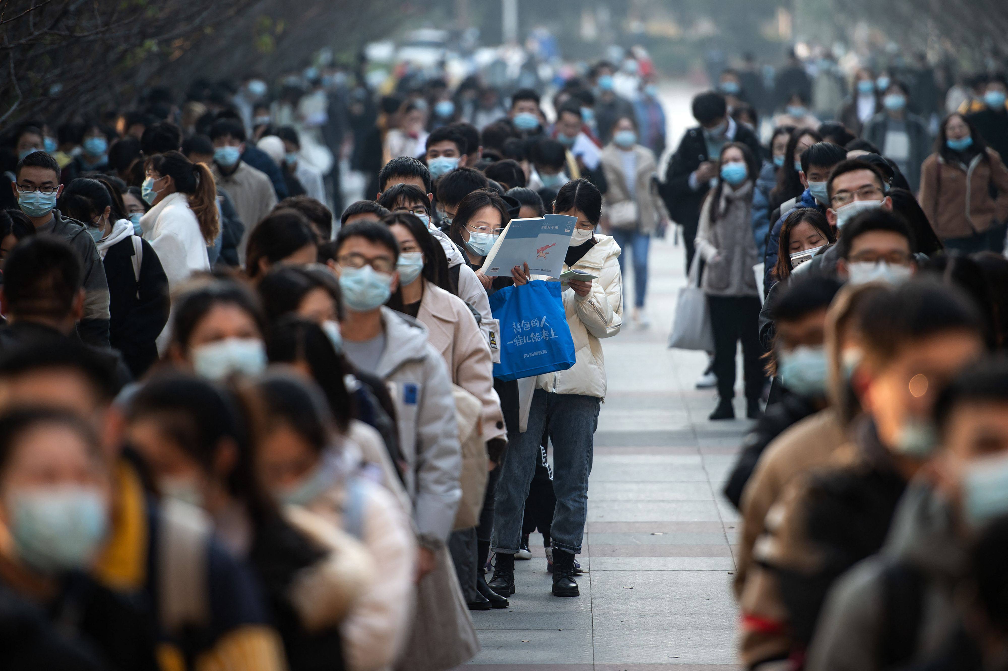 Candidates queue to take the exam for admission to the civil service in Wuhan on November 28, 2021. Civil service jobs have become highly coveted among young people in recent years amid an increasingly tight job market. Photo: AFP