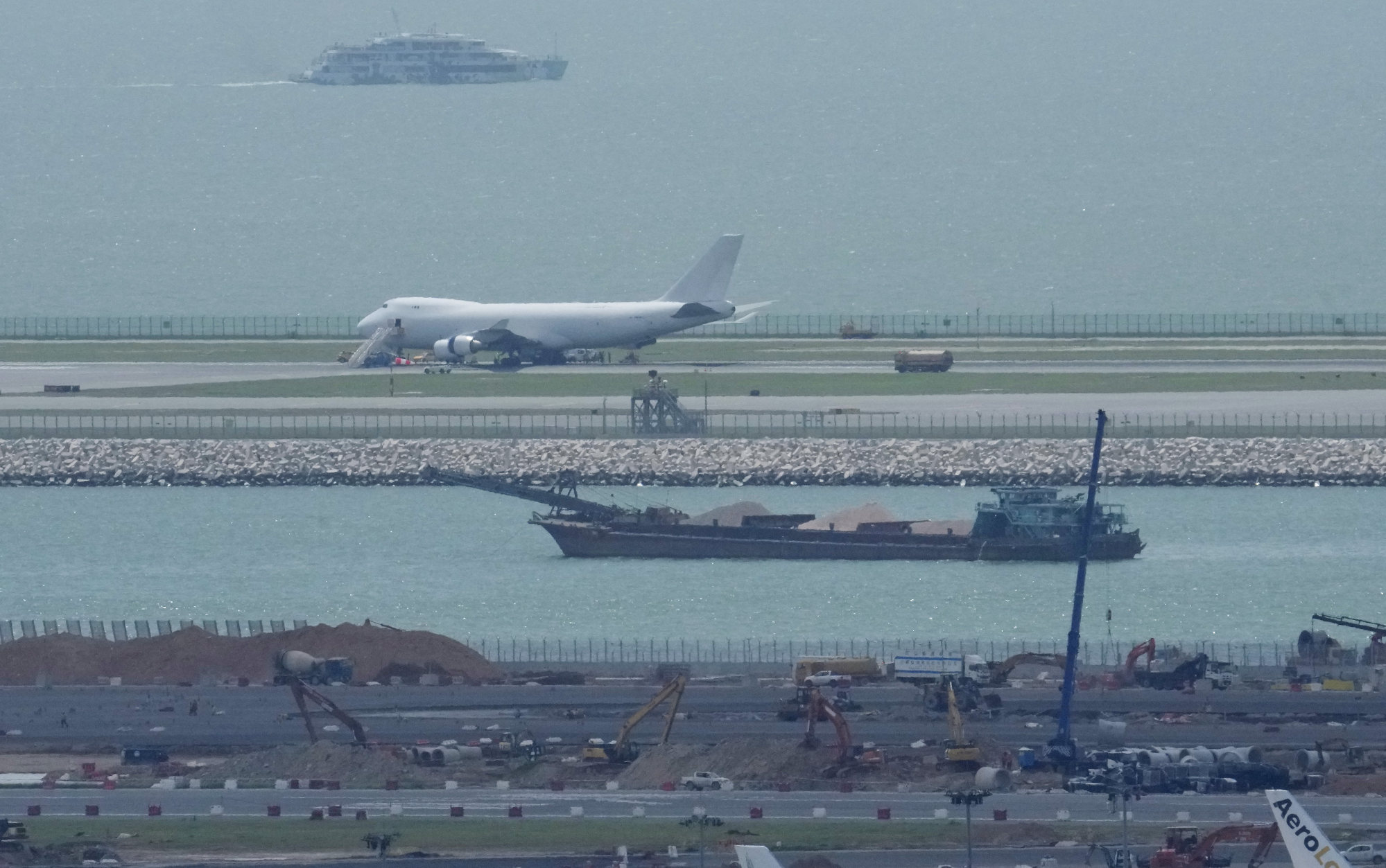 The cargo plane was stuck on the runway after suffering a hydraulics failure and a burst tyre. Photo: May Tse