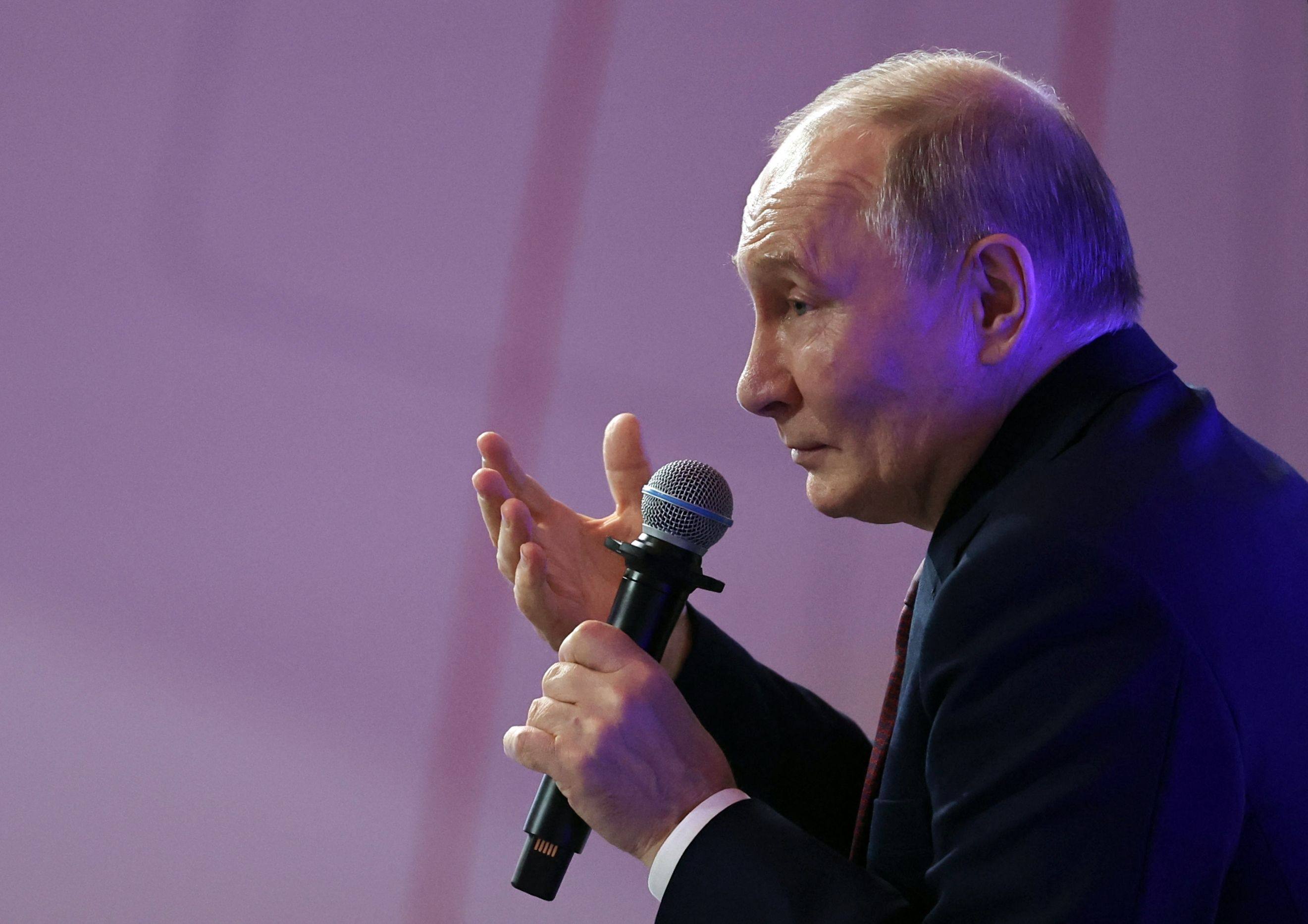 Russian President Vladimir Putin talks to service members at an event in the Moscow region on Friday. Photo: AFP