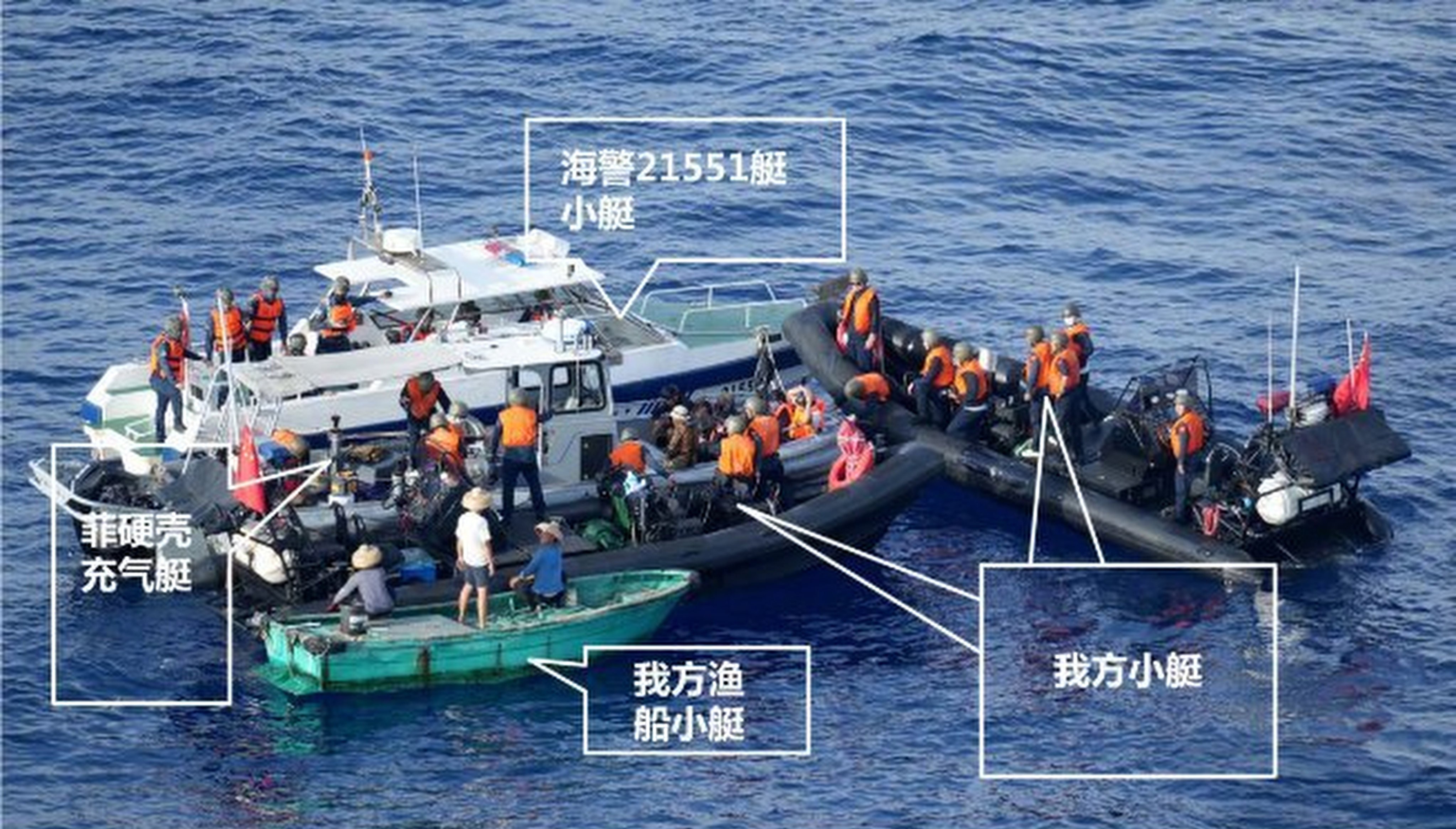 Chinese coastguard members are seen on the deck of the surrounded Philippine resupply boat on Monday. Photo: CCTV