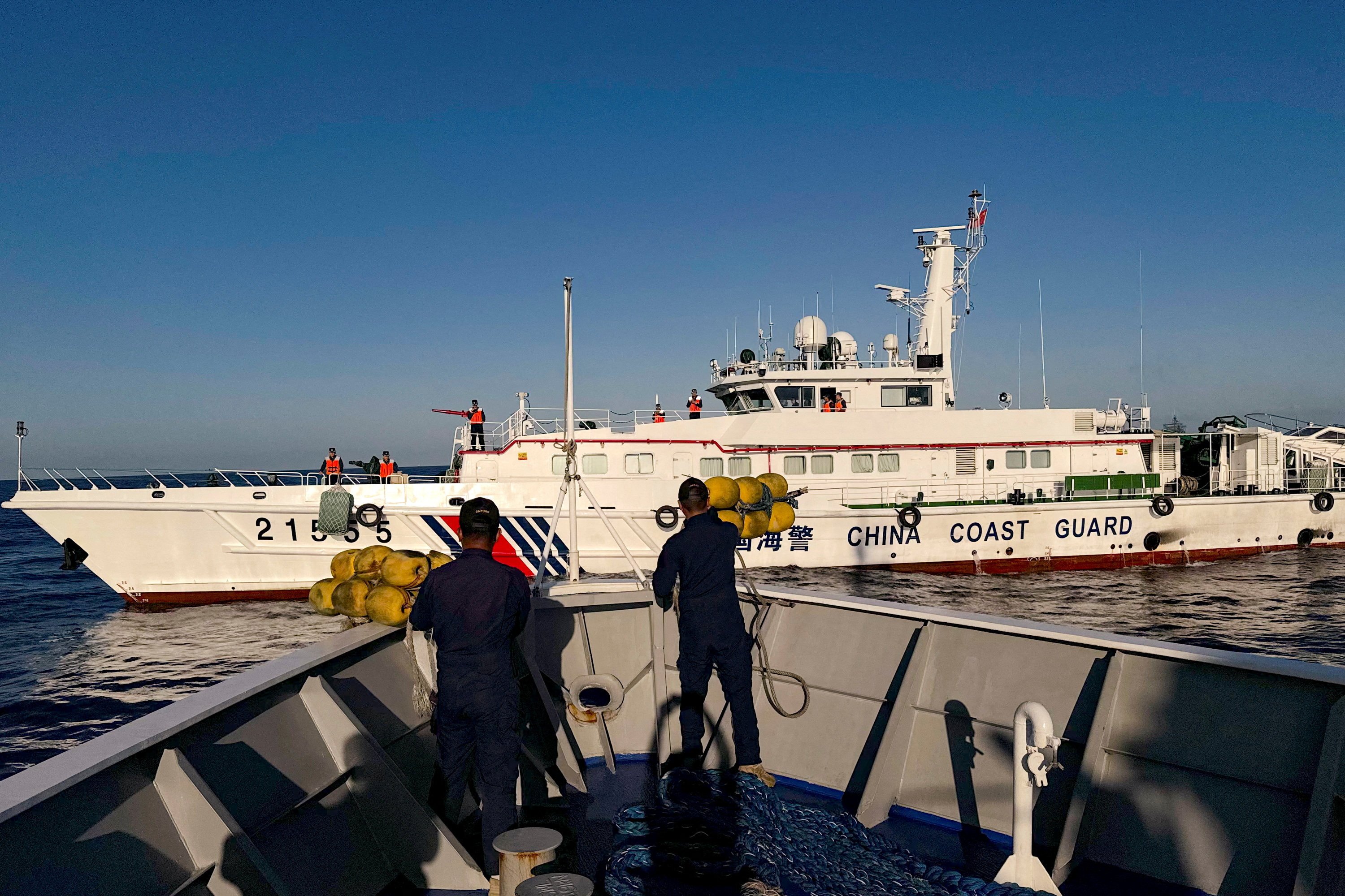 Philippine coastguard personnel prepare rubber fenders after Chinese coastguard vessels blocked their way to a resupply mission at the Second Thomas Shoal in the South China Sea on March 5. Photo: Reuters