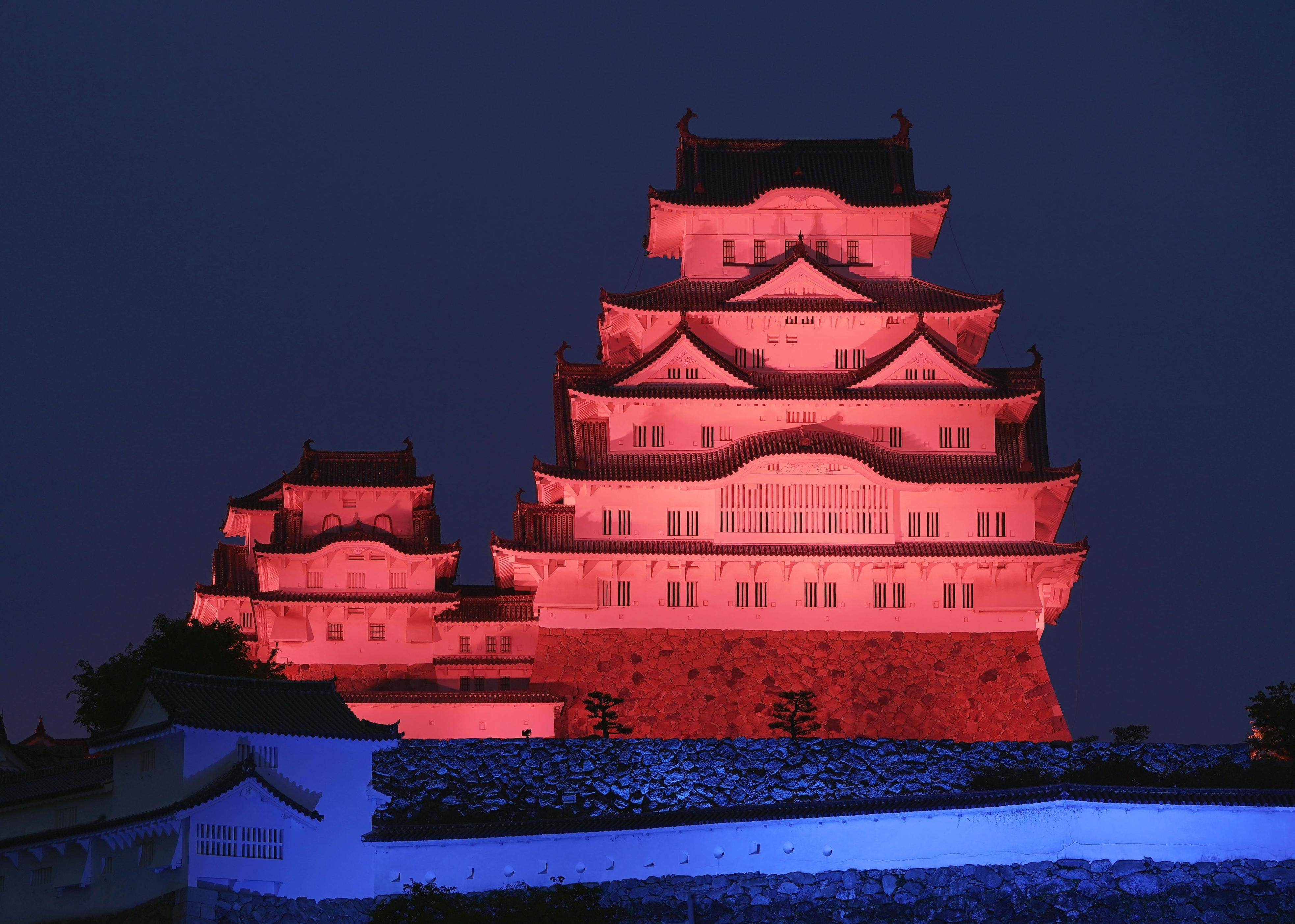 The World Heritage-listed Himeji Castle, in Hyogo prefecture, western Japan, is seen lit up in red and blue on Monday. Photo: Kyodo