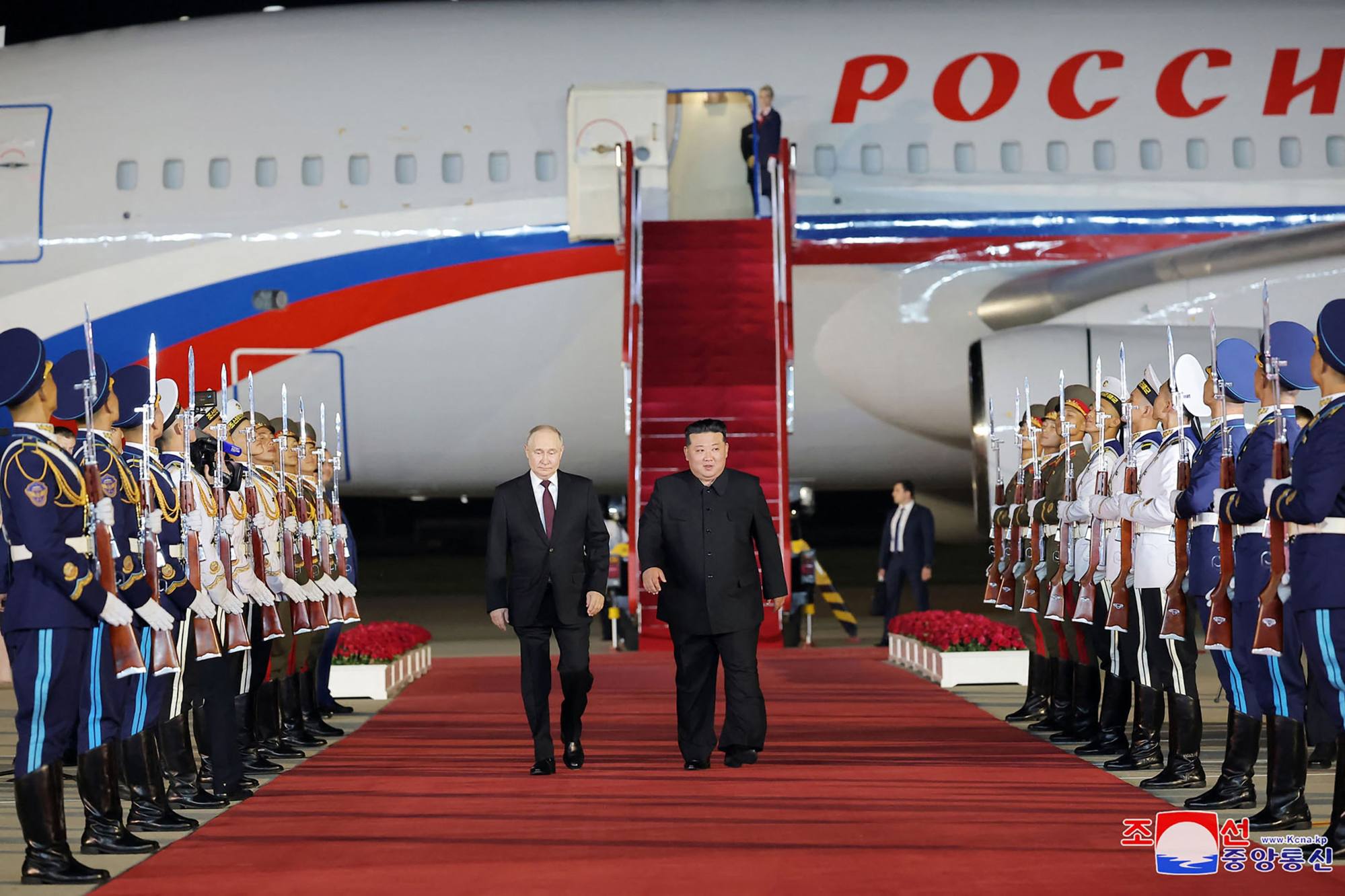 North Korean leader Kim Jong-un and Russian President Vladimir Putin walk past an honour guard upon the latter’s arrival at Pyongyang International Airport on Wednesday. Photo: KCNA via KNS/AFP