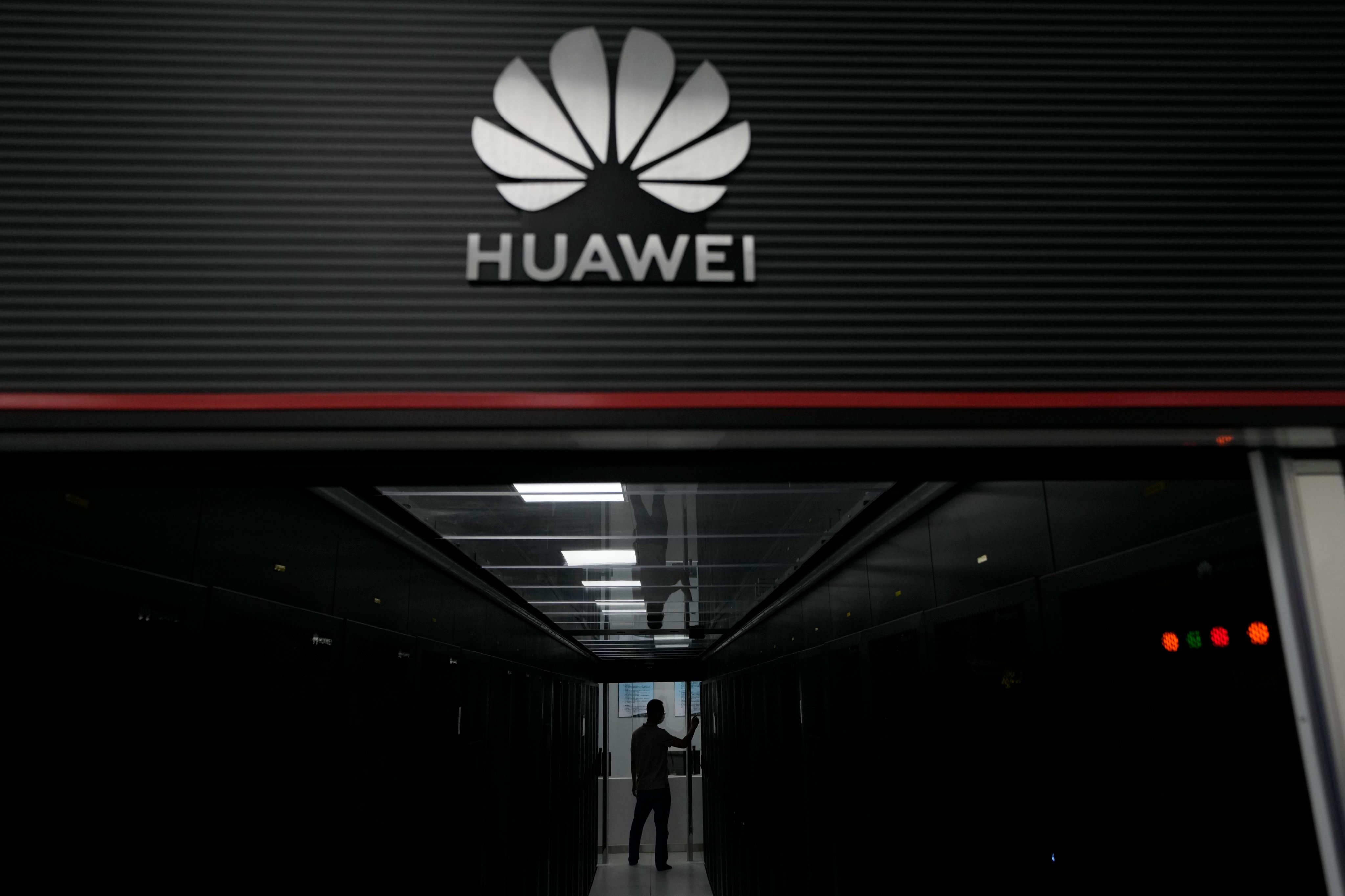A technician stands at the entrance to a Huawei 5G data server centre at the Guangdong Second Provincial General Hospital in Guangzhou, southern China. Photo: AP 