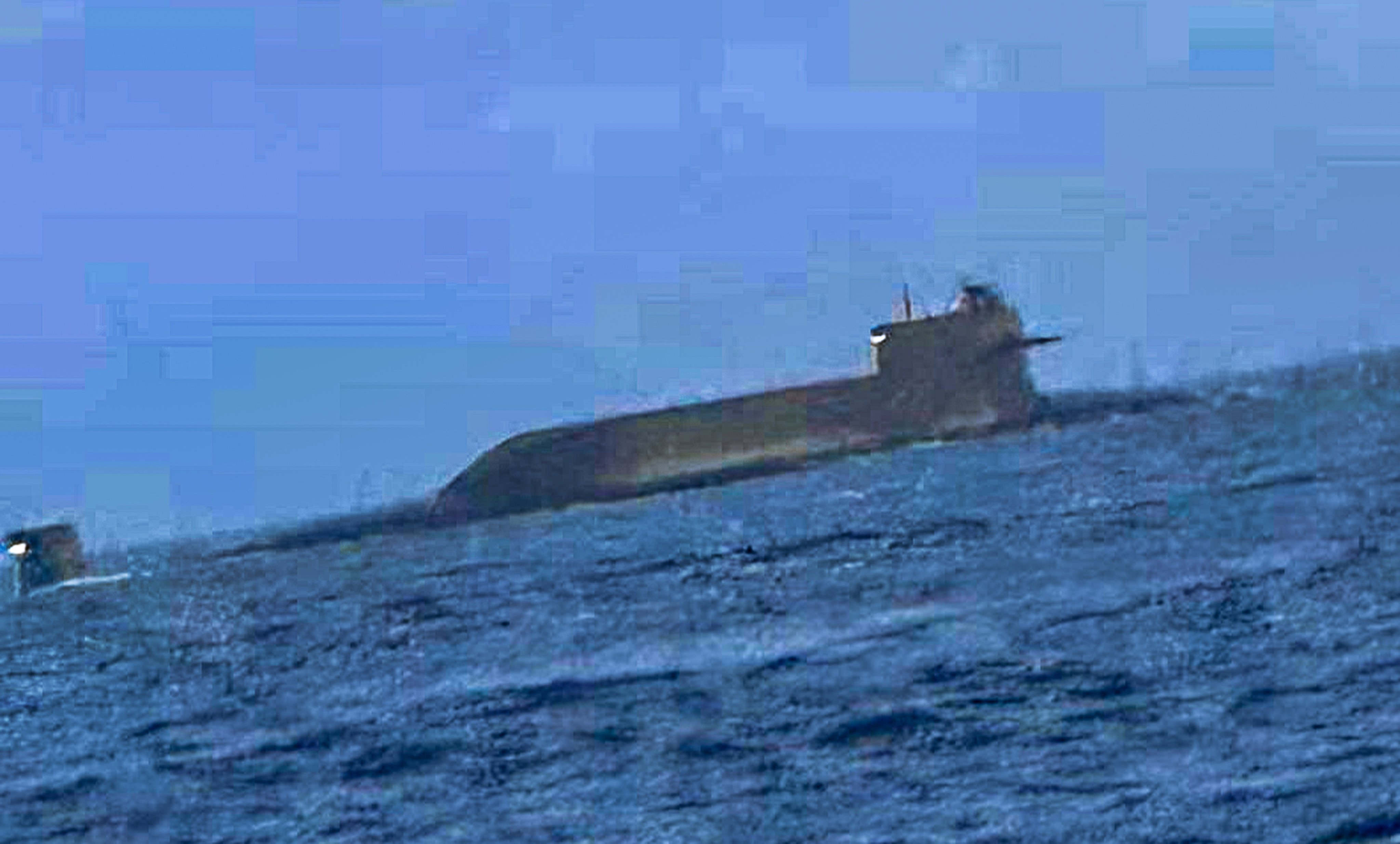 A PLA nuclear-powered submarine, thought to be a Type 094, was caught on camera by fisherman when it suddenly surfaced early Tuesday morning in the Taiwan Strait. Photo: Handout