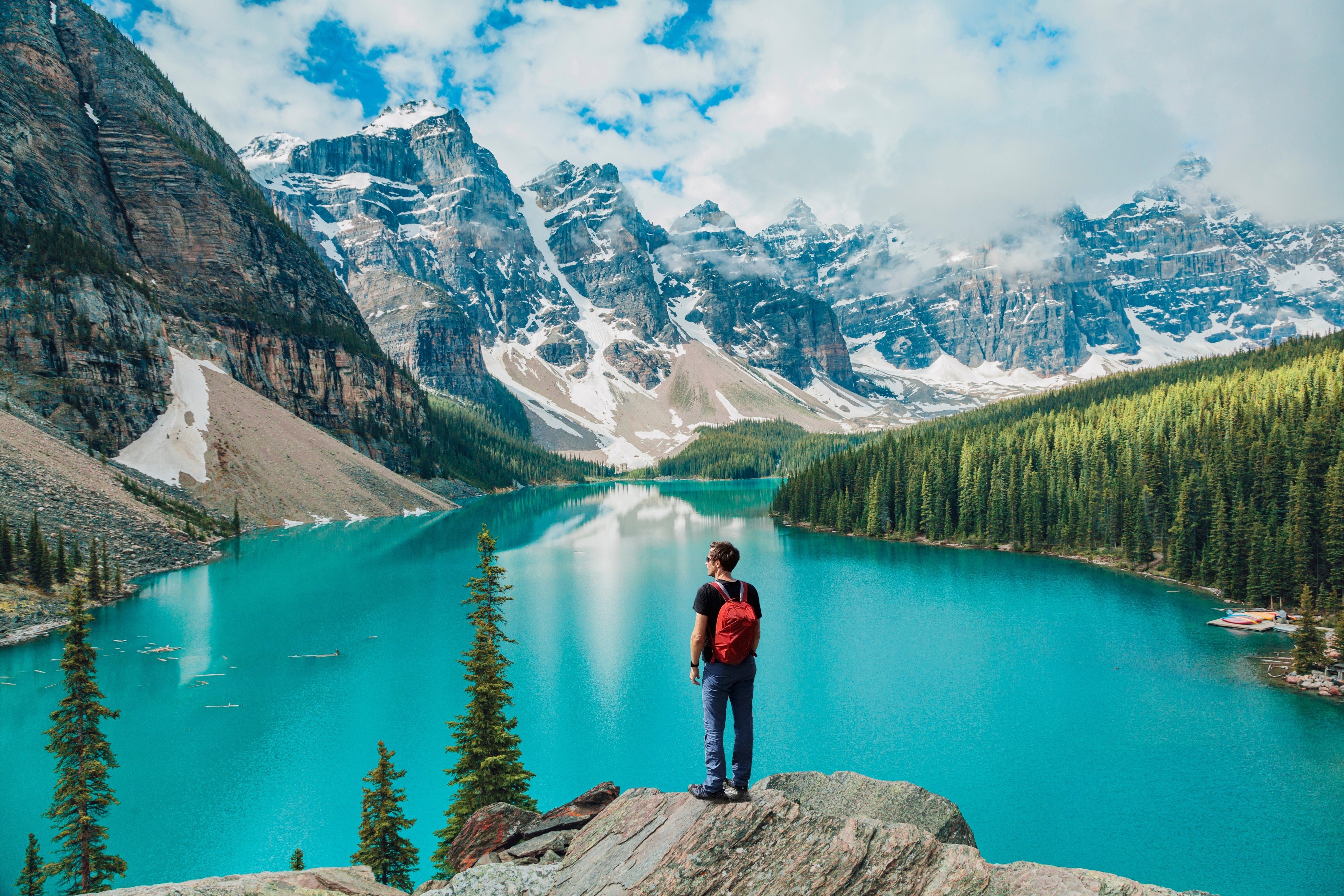 A tourist in Banff, Canada. Interest in “coolcations” – holidays in cooler places – is growing as climate breakdown pushes summer temperatures to record highs from Southeast Asia to Europe. Photo: Shutterstock