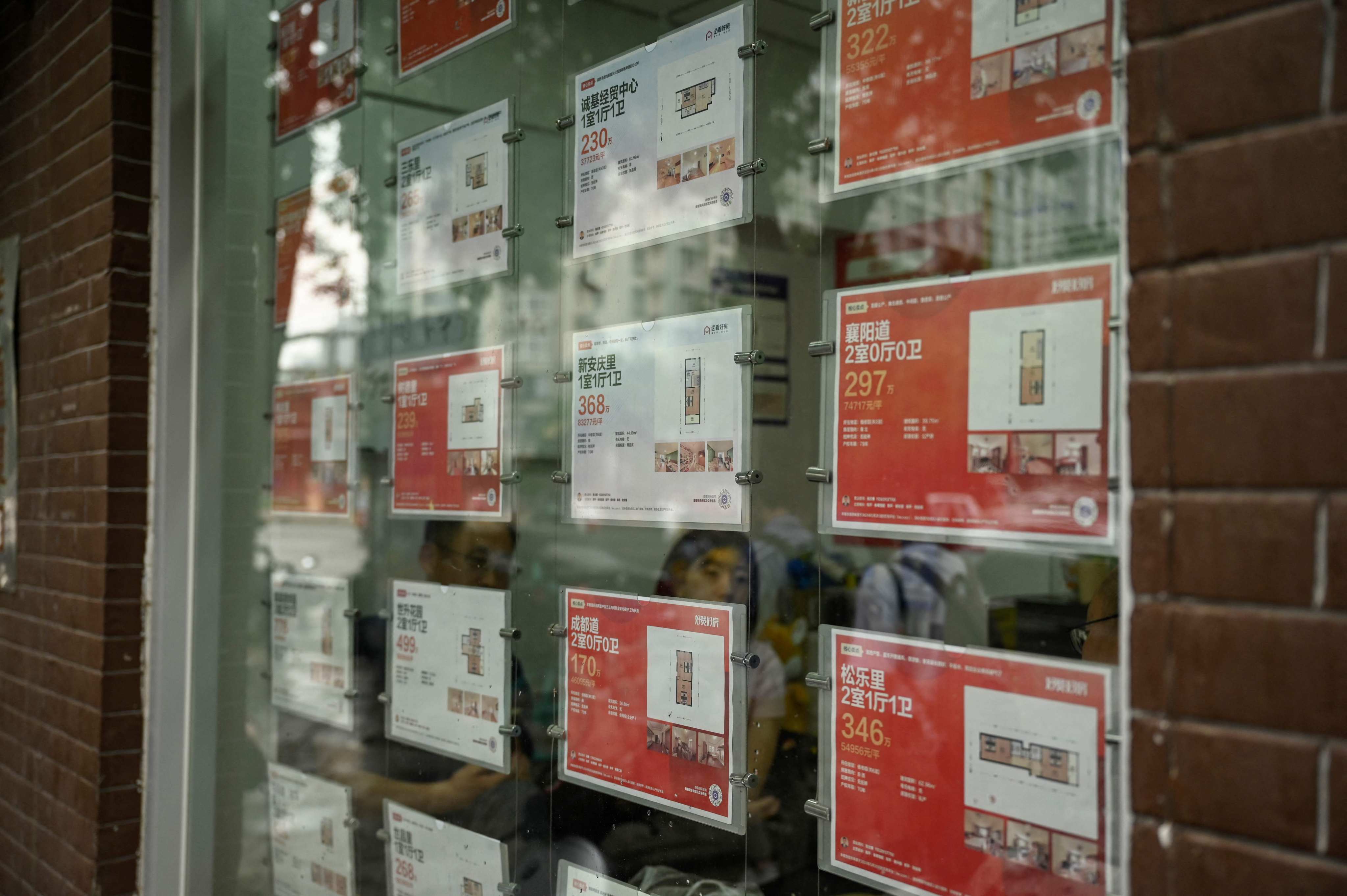The photo taken on June 5, 2024 shows property for sale at a real estate agent’s window in Tianjin. Photo: AFP