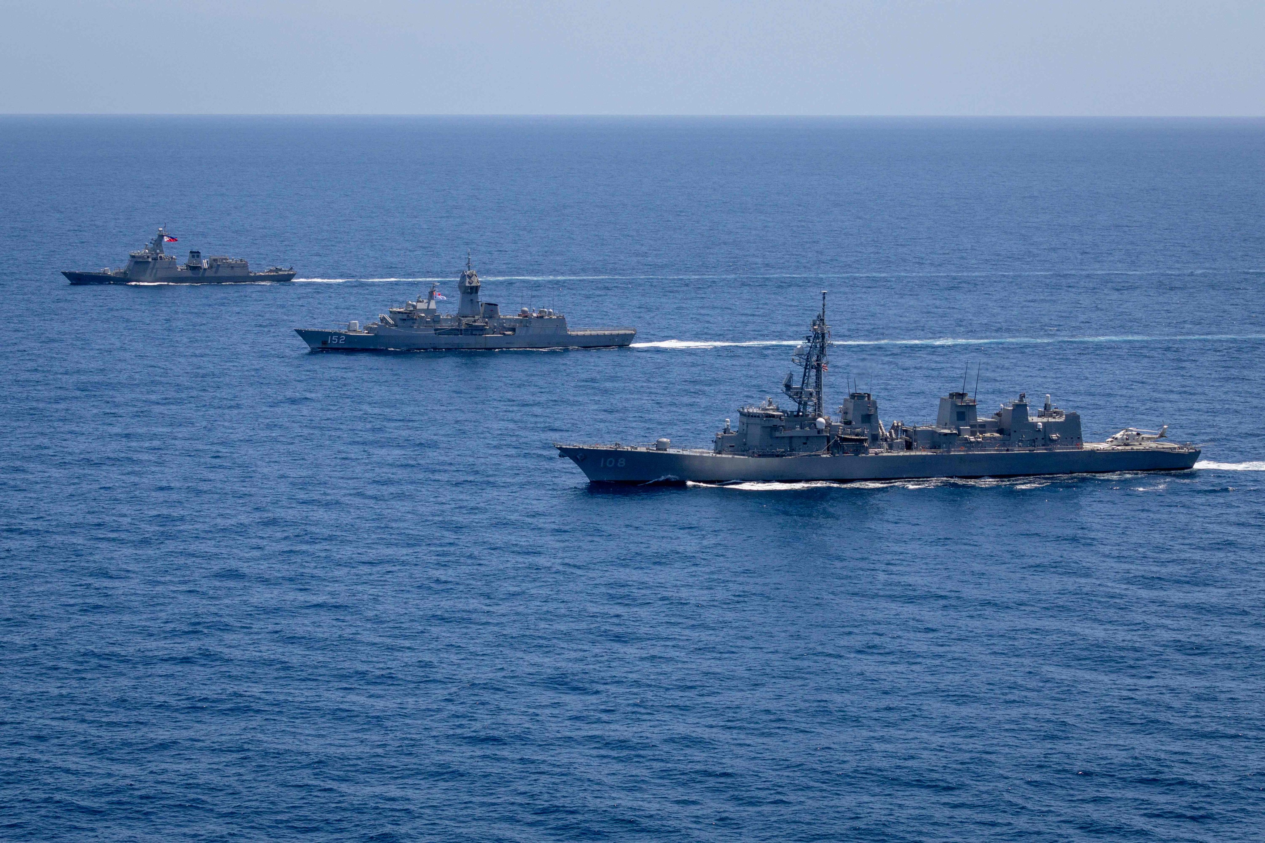 Ships sail in formation during a “maritime cooperative activity” between Australia, the United States, Japan and the Philippines in Manila’s exclusive economic zone on April 7. Photo: AFP/Australian Department of Defence/Leo Baumgartner