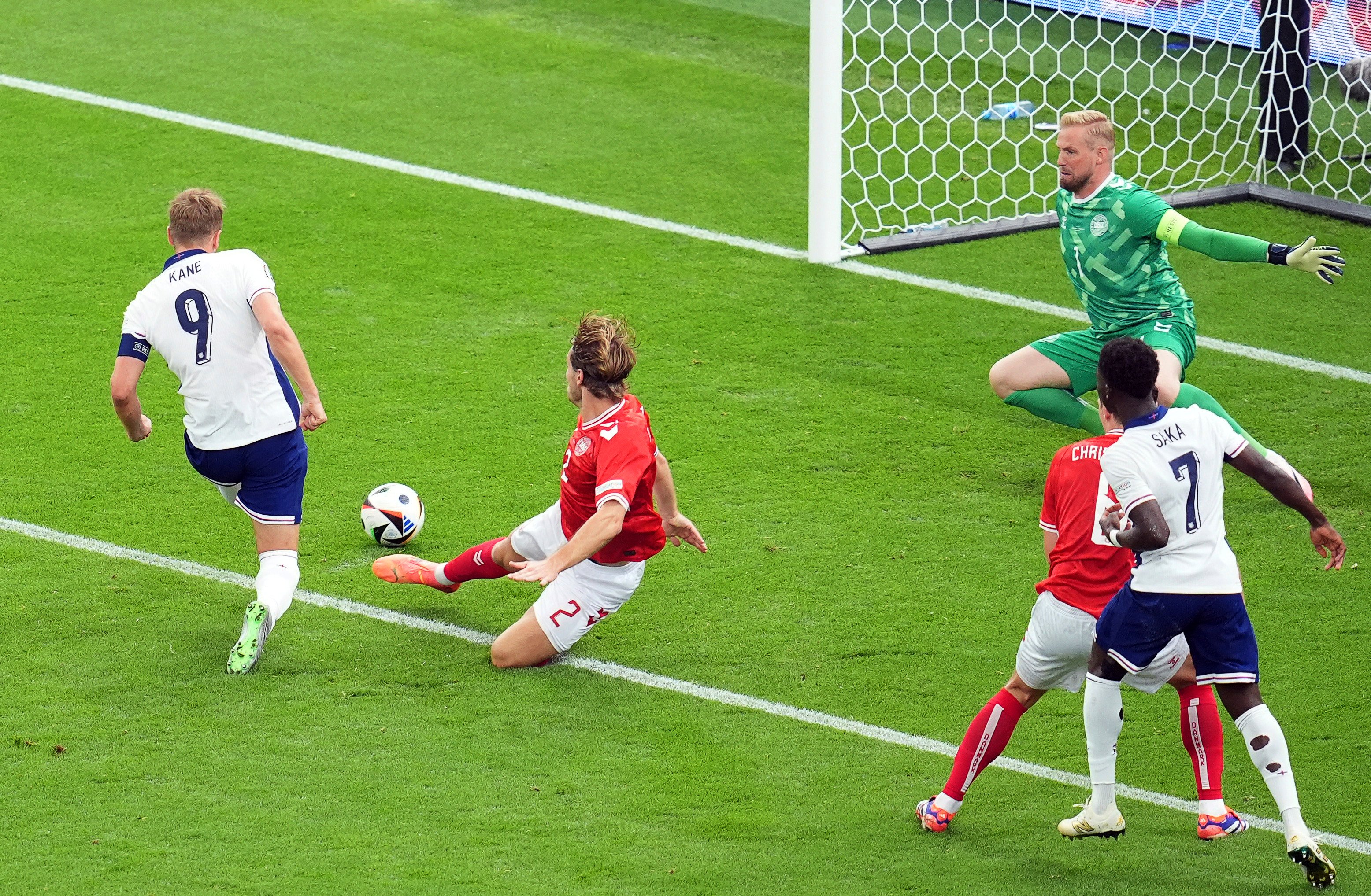 England’s Harry Kane (left) scores the opening goal against Denmark in Frankfurt. Photo: AP