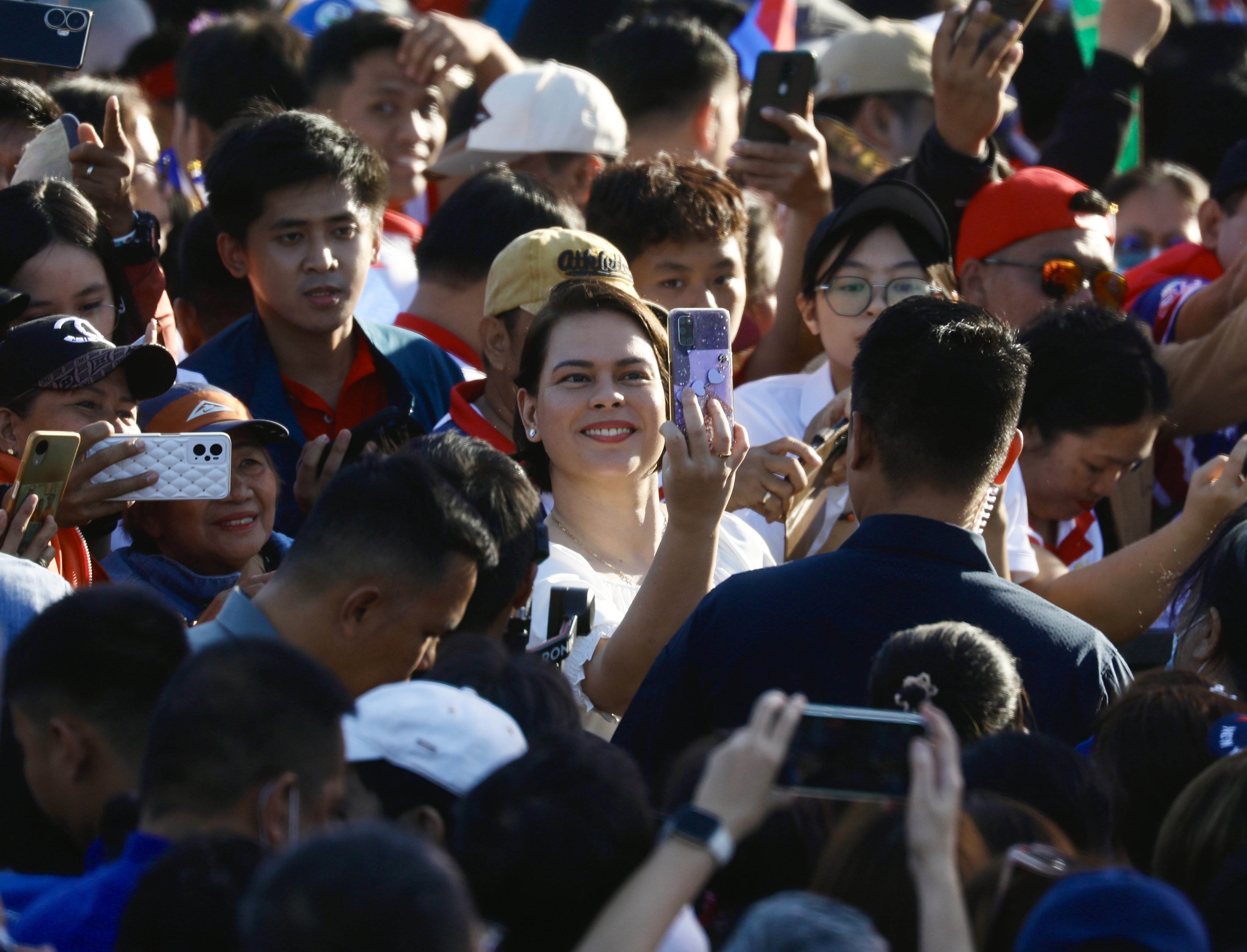 Philippine Vice-president Sara Duterte (centre) takes a selfie with her supporters during a January rally in Manila. Photo: EPA-EFE