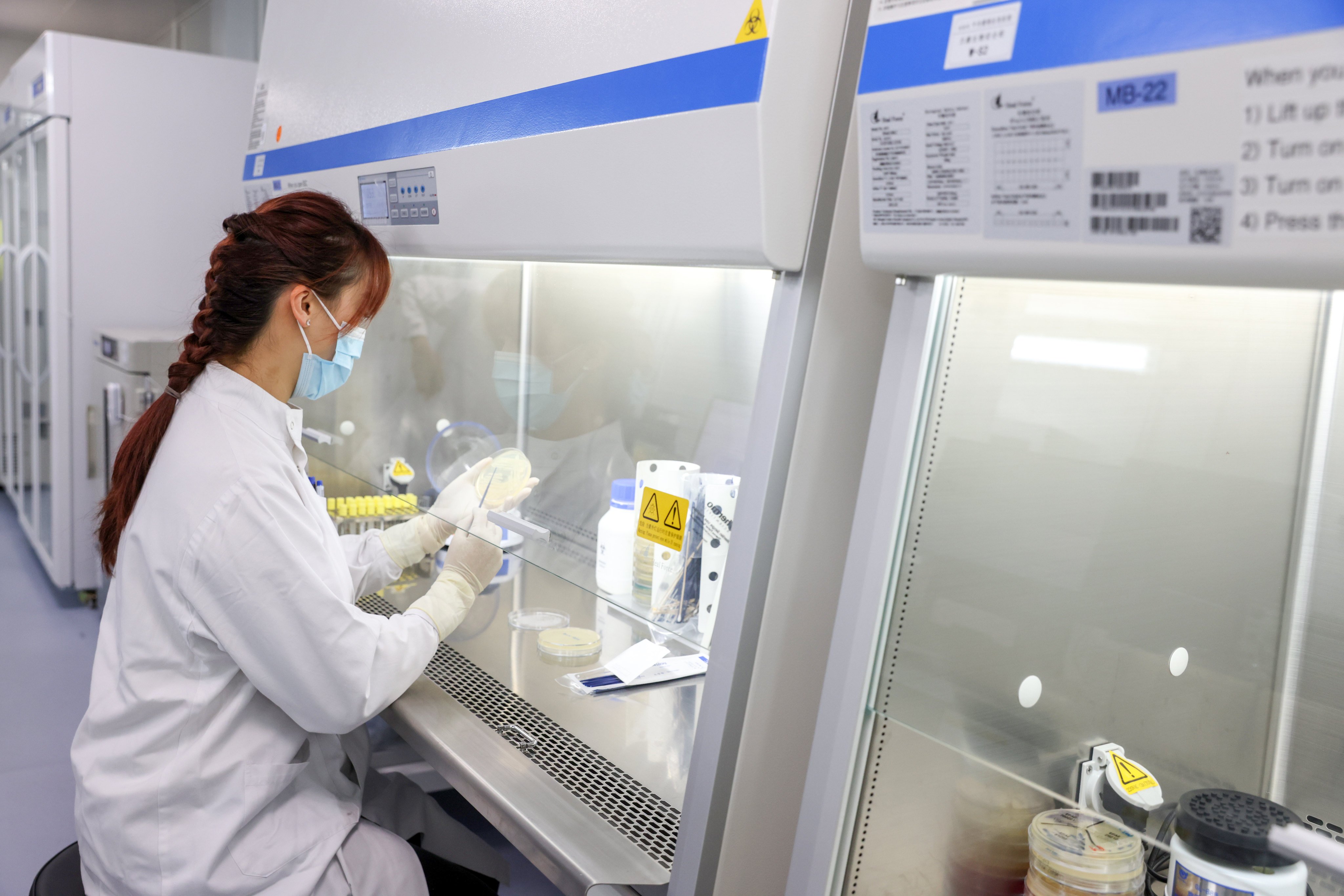 On October 19, 2023, an employee works at the microbiology laboratory in a Lok Ma Chau hospital built for Covid-19 patients. Financial services remain a key pillar in Hong Kong, but diversification into new areas of growth and new channels of capital formation is necessary to sustain its growth. Photo: Yik Yeung-man