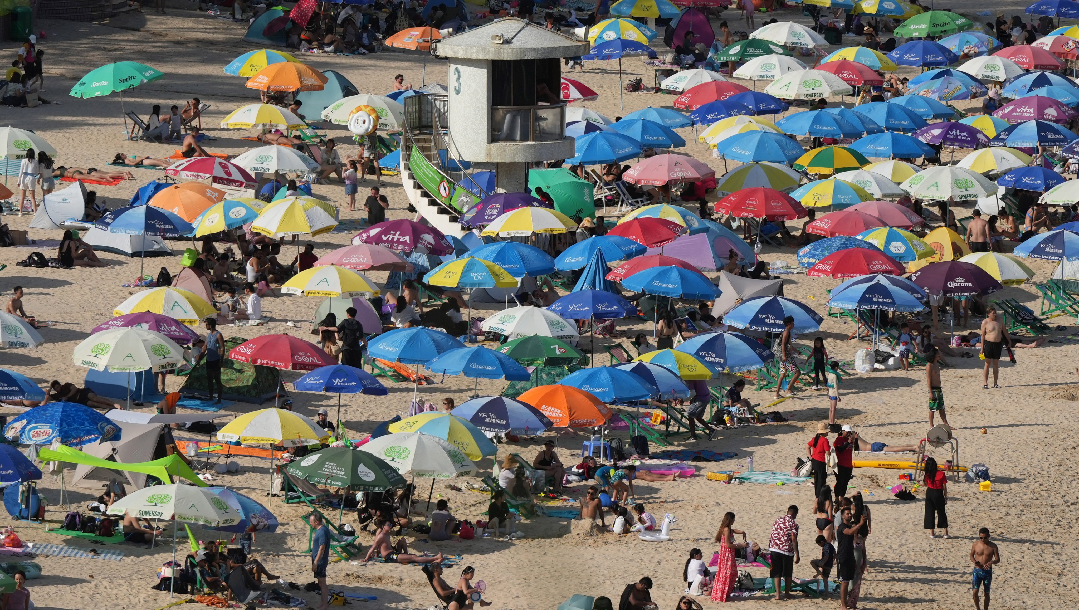 Beachgoers enjoy a sunny afternoon at Shek O beach on Buddha’s birthday holiday. Photo: May Tse