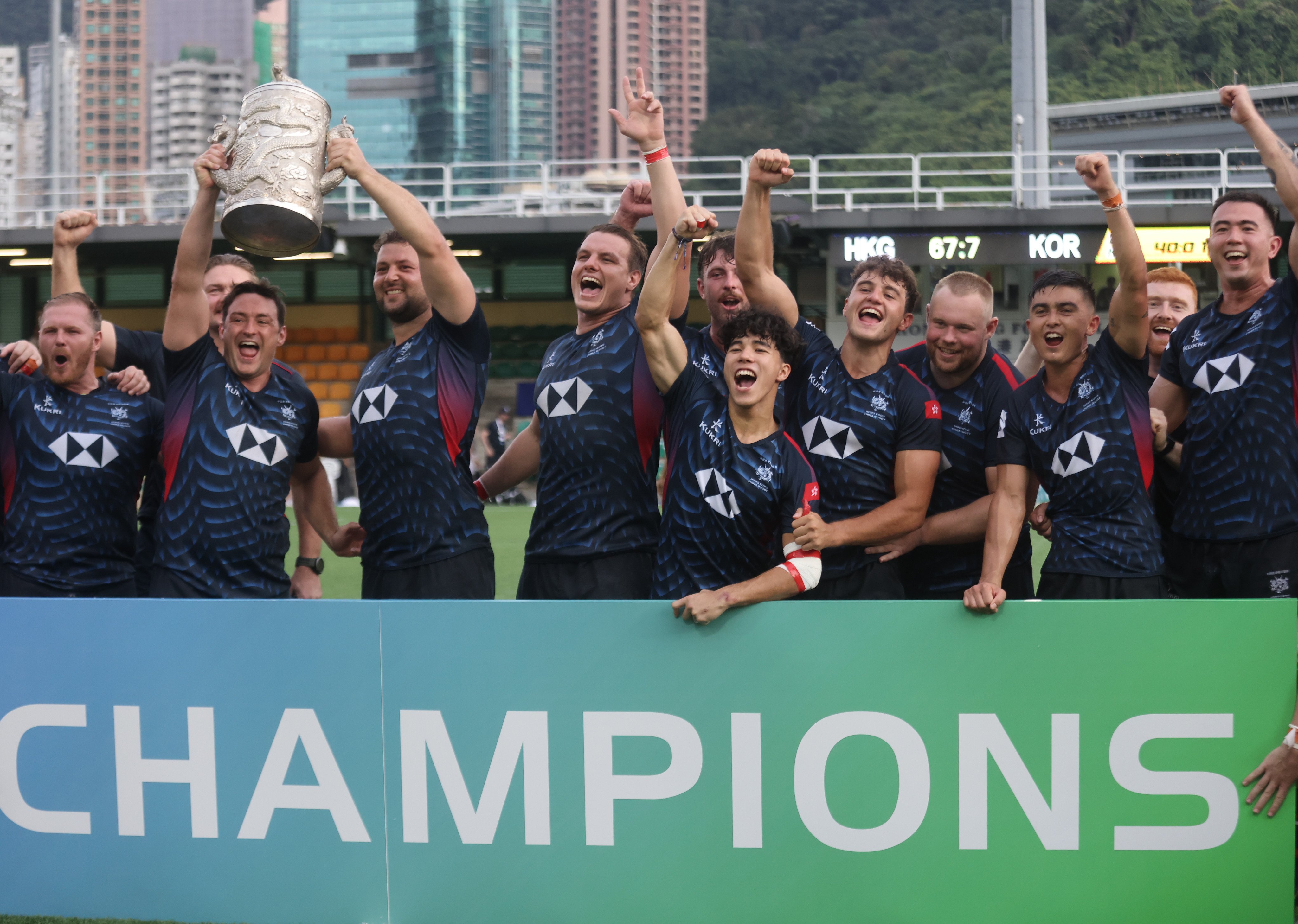 Triumphant Hong Kong celebrate clinching a fifth straight Asia Rugby Championship title. Photo: Jonathan Wong