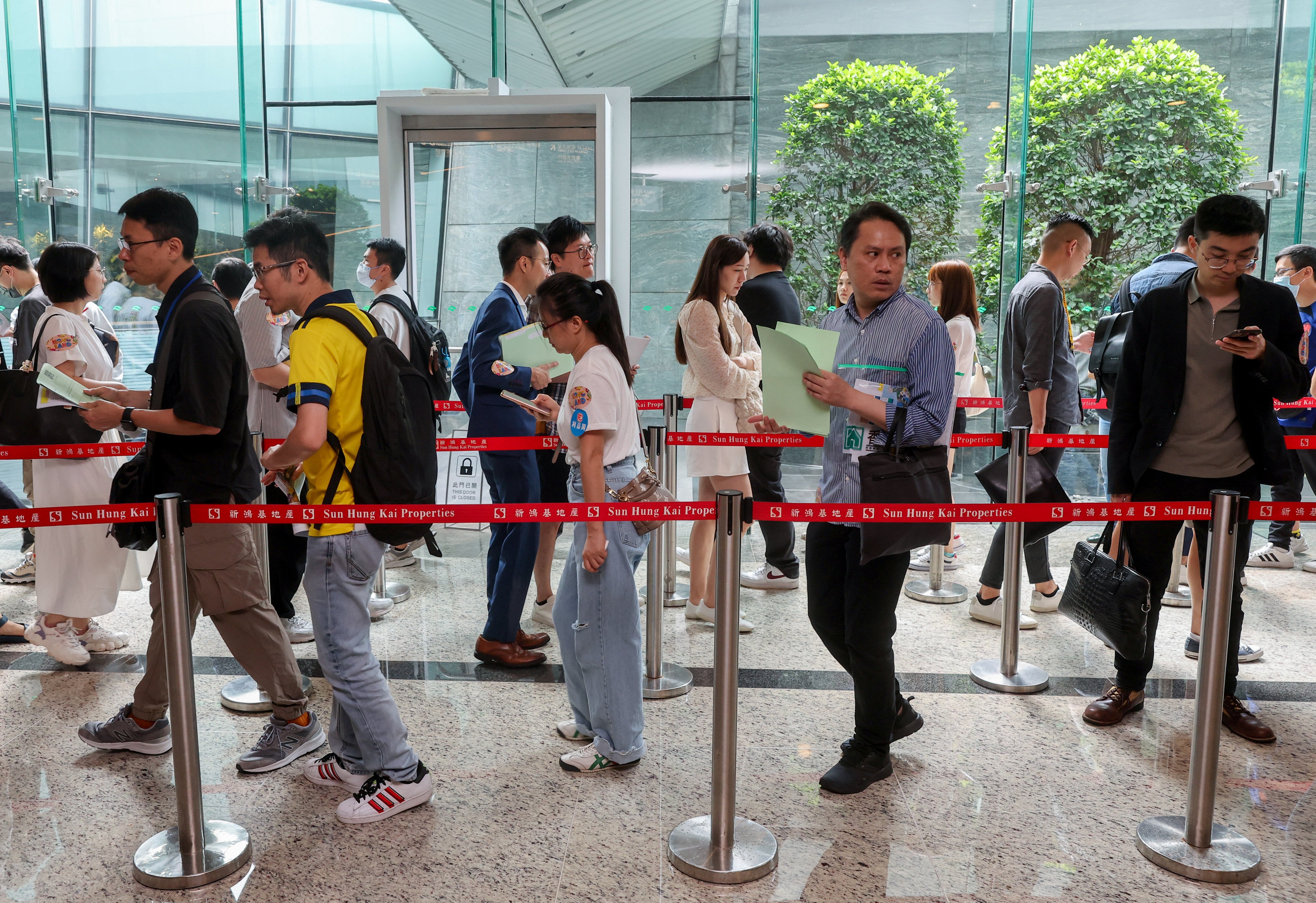 Potential buyers at the sales office of SHKP’s Novo Land at the International Commerce Centre in West Kowloon. Photo: Edmond So