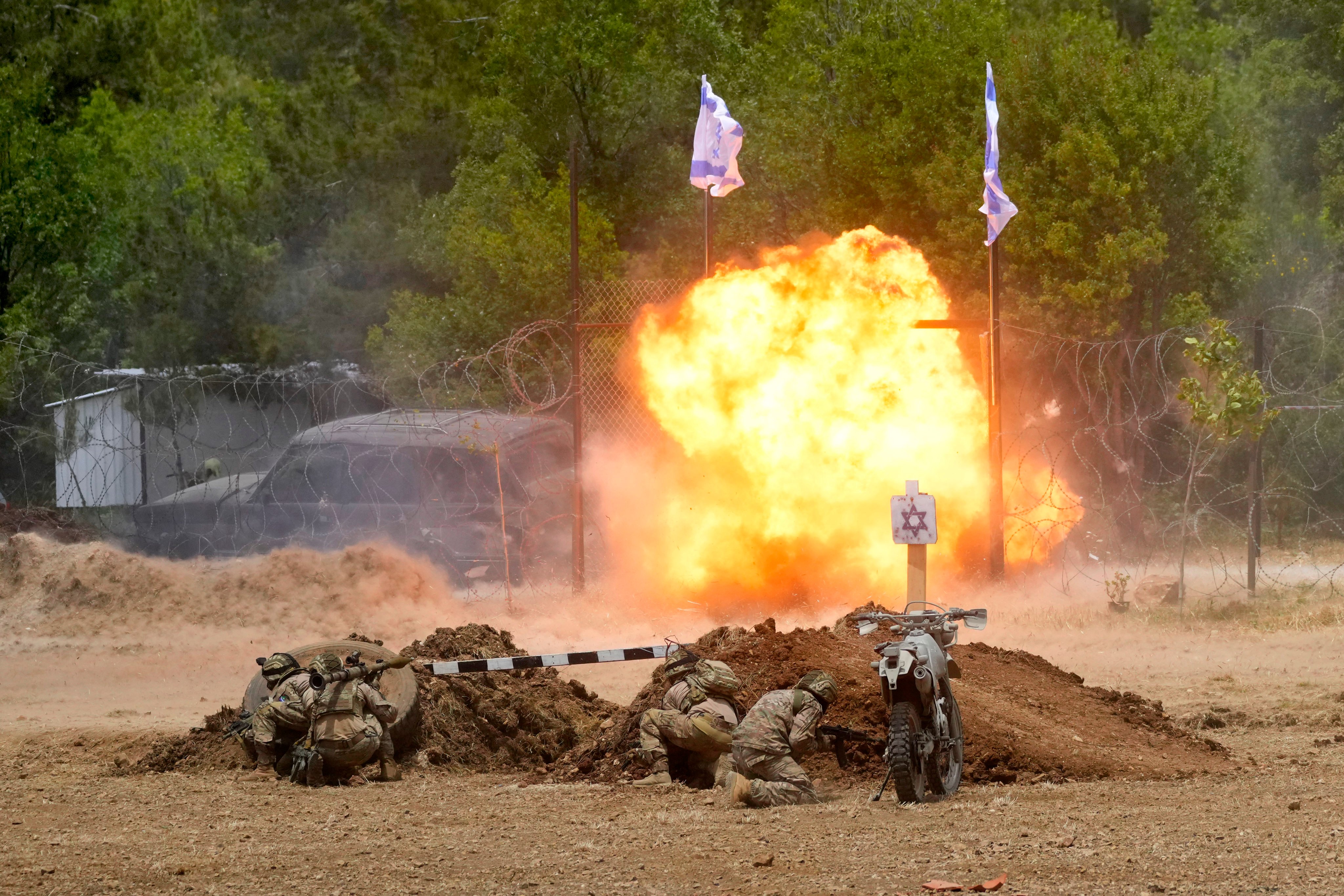 Fighters from the Lebanese militant group Hezbollah carry out a training exercise. Photo: AP