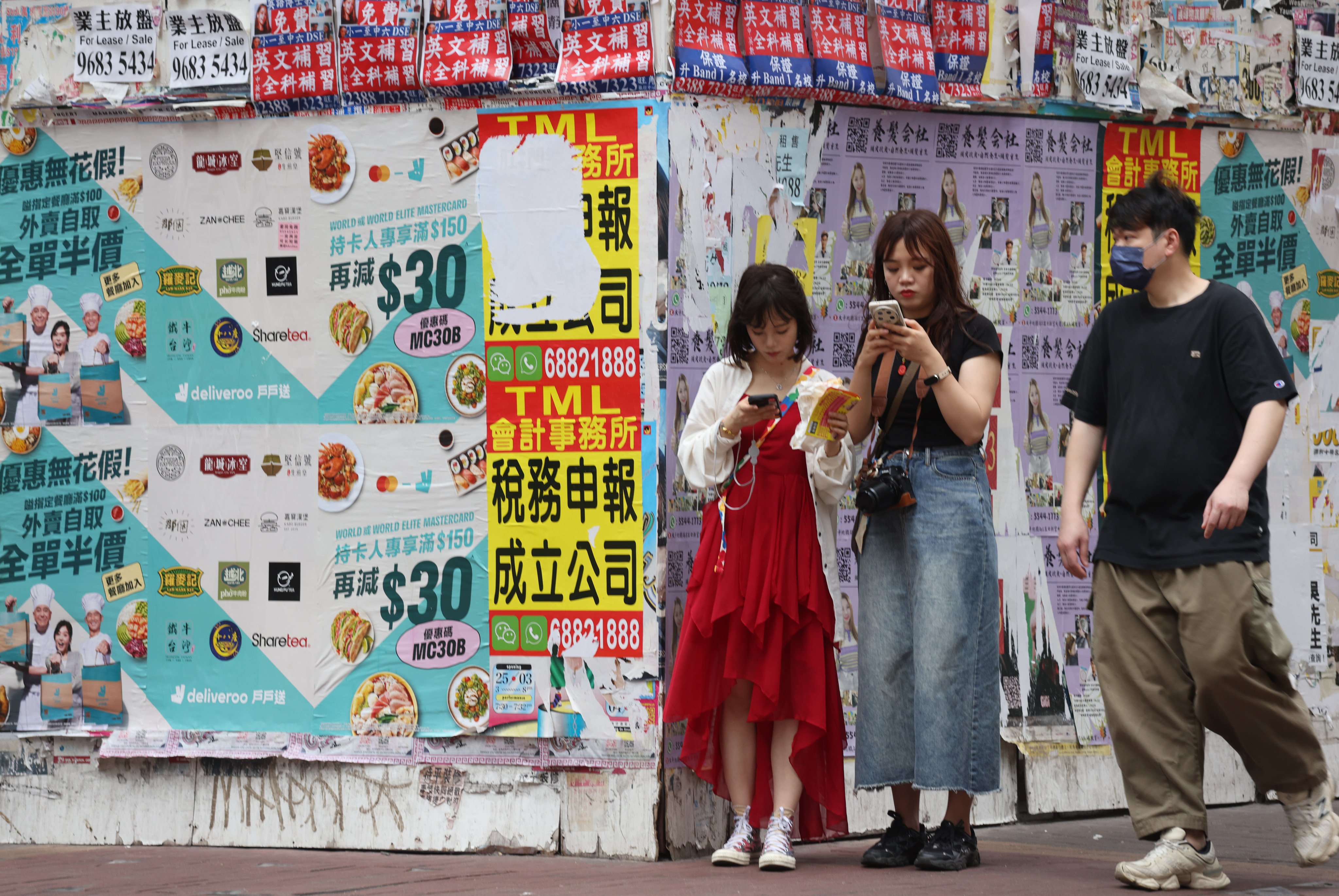 People pass by a closed shop in Mong Kok The city’s famously high property rents are a constant threat to the survival of retailers. Photo: SCMP Pictures