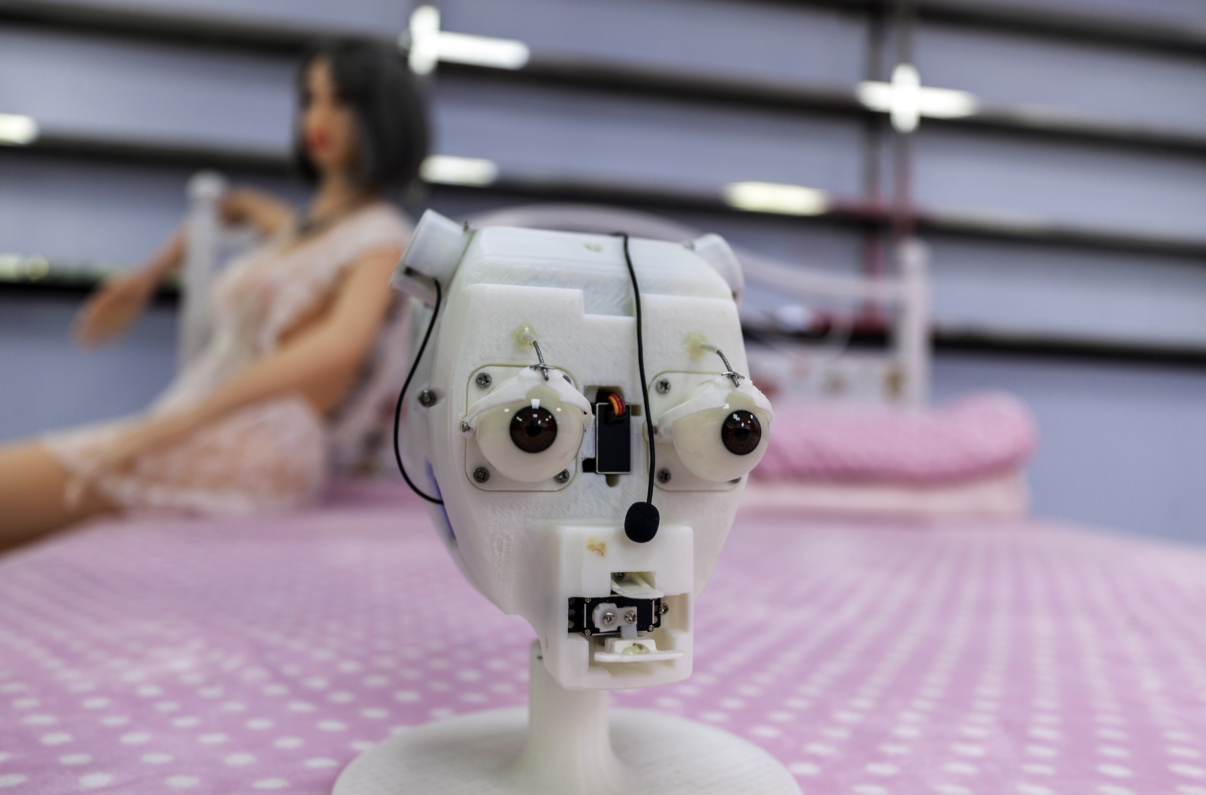 The head of an AI-enhanced sex robot is displayed at the Shenzhen Atall Intelligent Robot Technology headquarters. As AI technology becomes more advanced, its use in sex robots is raising concerns about issues of ethics and consent. Photo: EPA-EFE