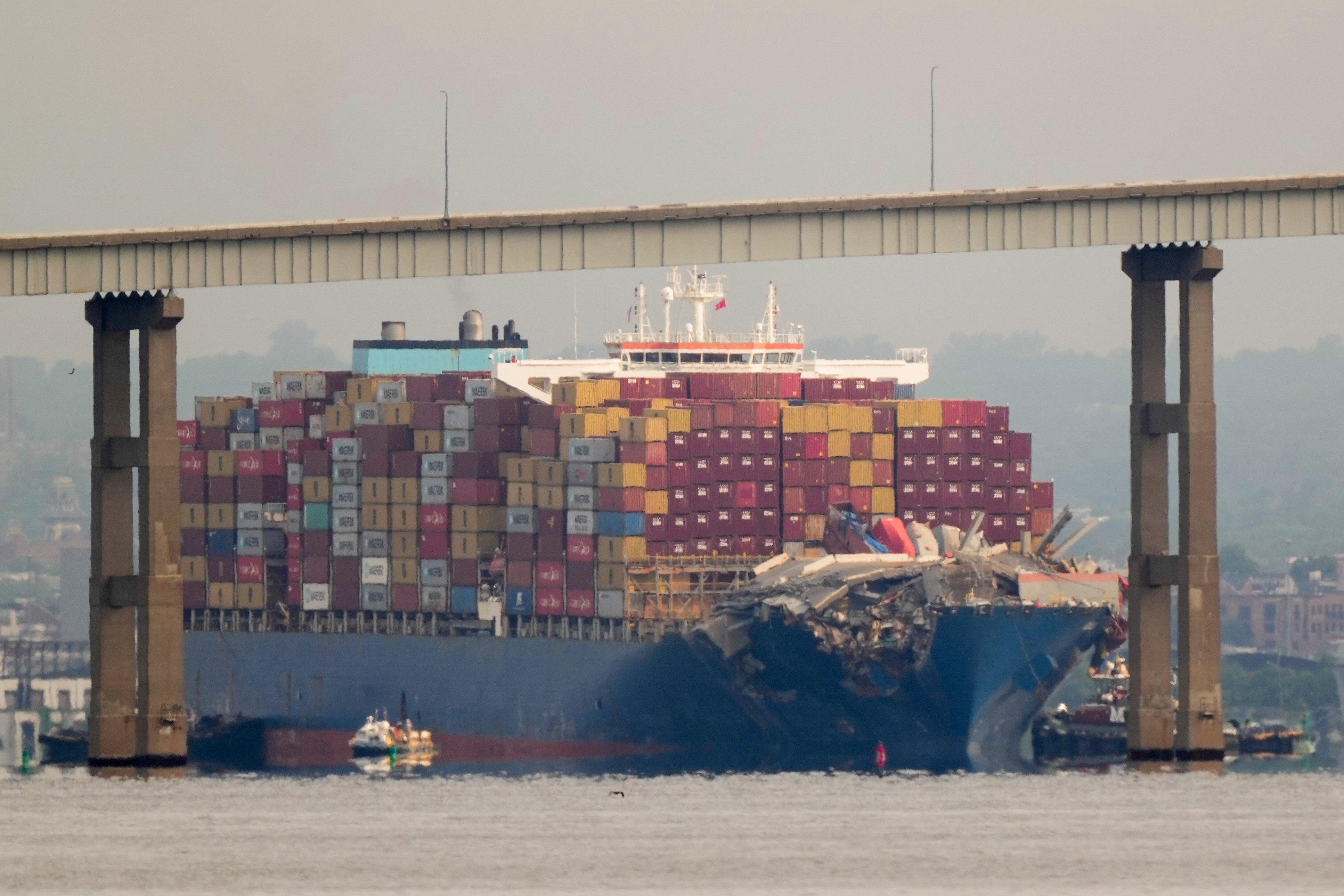 Tugboats escort the cargo ship Dali after it was refloated on May 20. On Monday, the ship left Baltimore 3 months after losing power and hitting the Francis Scott Key bridge’s supporting columns.