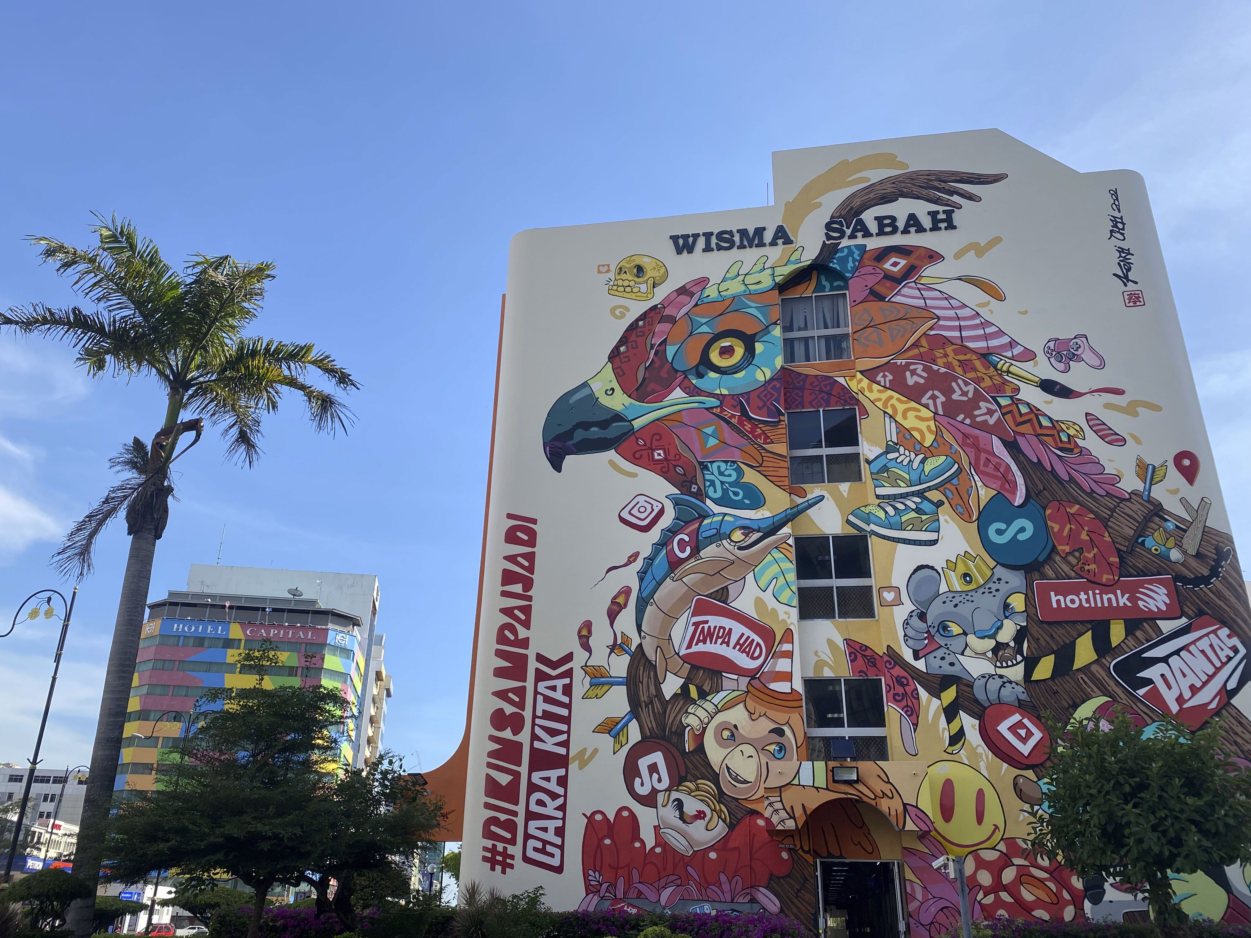 A mural on a mall in Kota Kinabalu, Malaysia, advertises mobile-telephony provider Hotlink. The street art scene in the capital of Sabah state is flourishing, but big-brand sponsorship threatens to undermine its message of local pride. Photo: Tamara Hinson