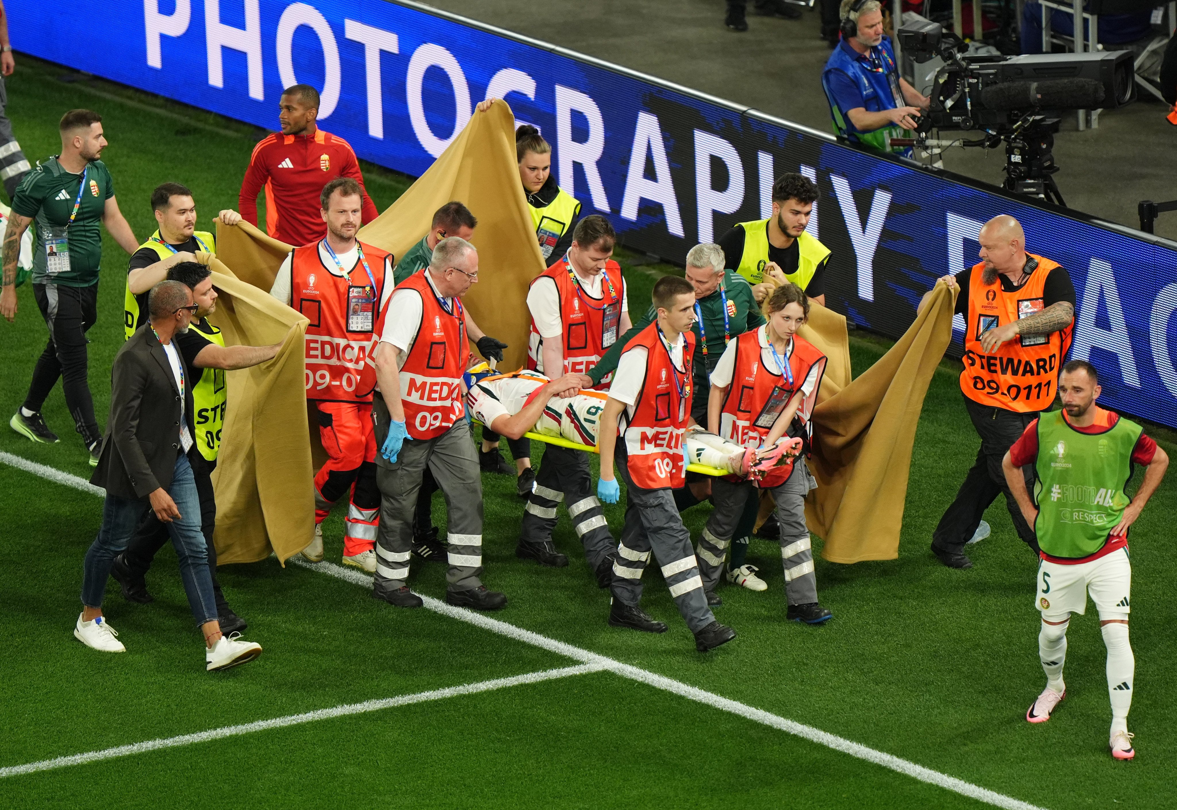 Hungary’s Barnabas Varga is stretchered off after suffering a sickening injury during the win over Scotland. Photo: DPA