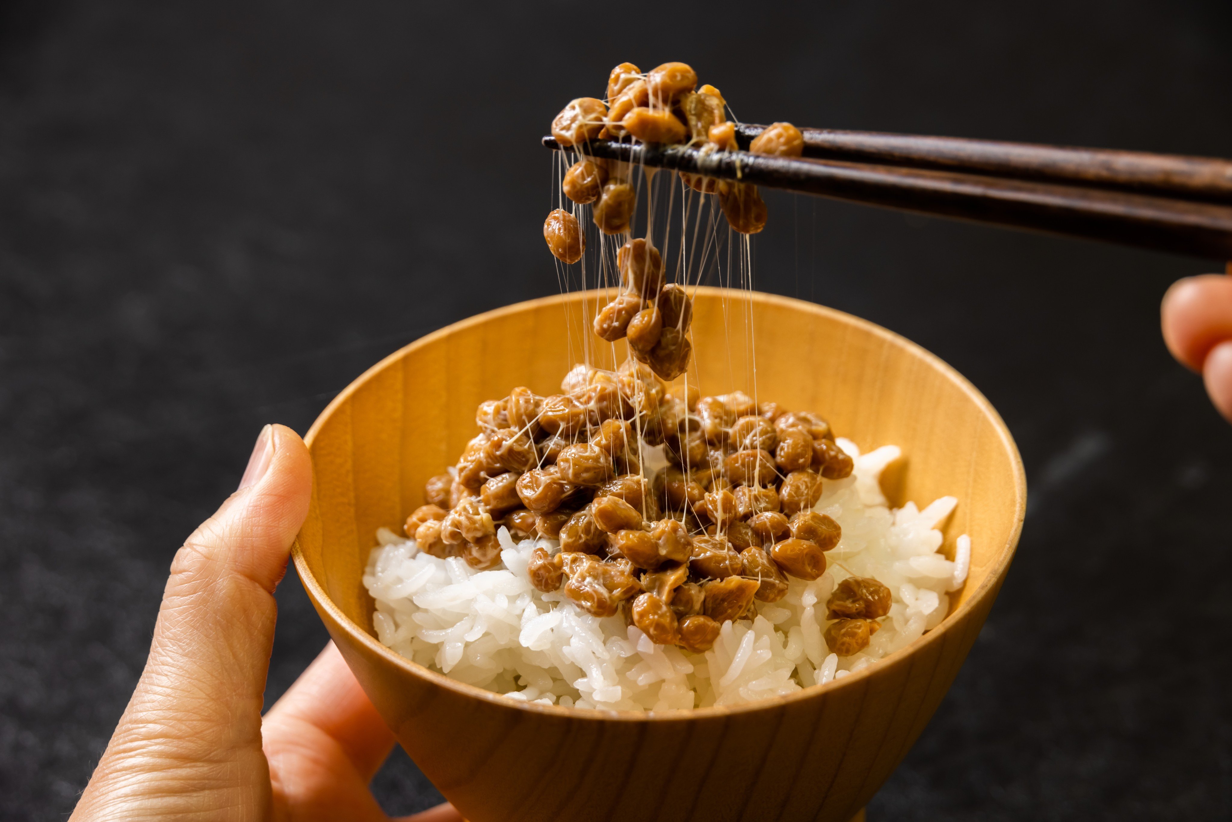 Natto is widely consumed in Japan as a budget superfood, but the fermented soybeans’ pungent aroma and wildly sticky texture are not for everyone. Photo: Shutterstock