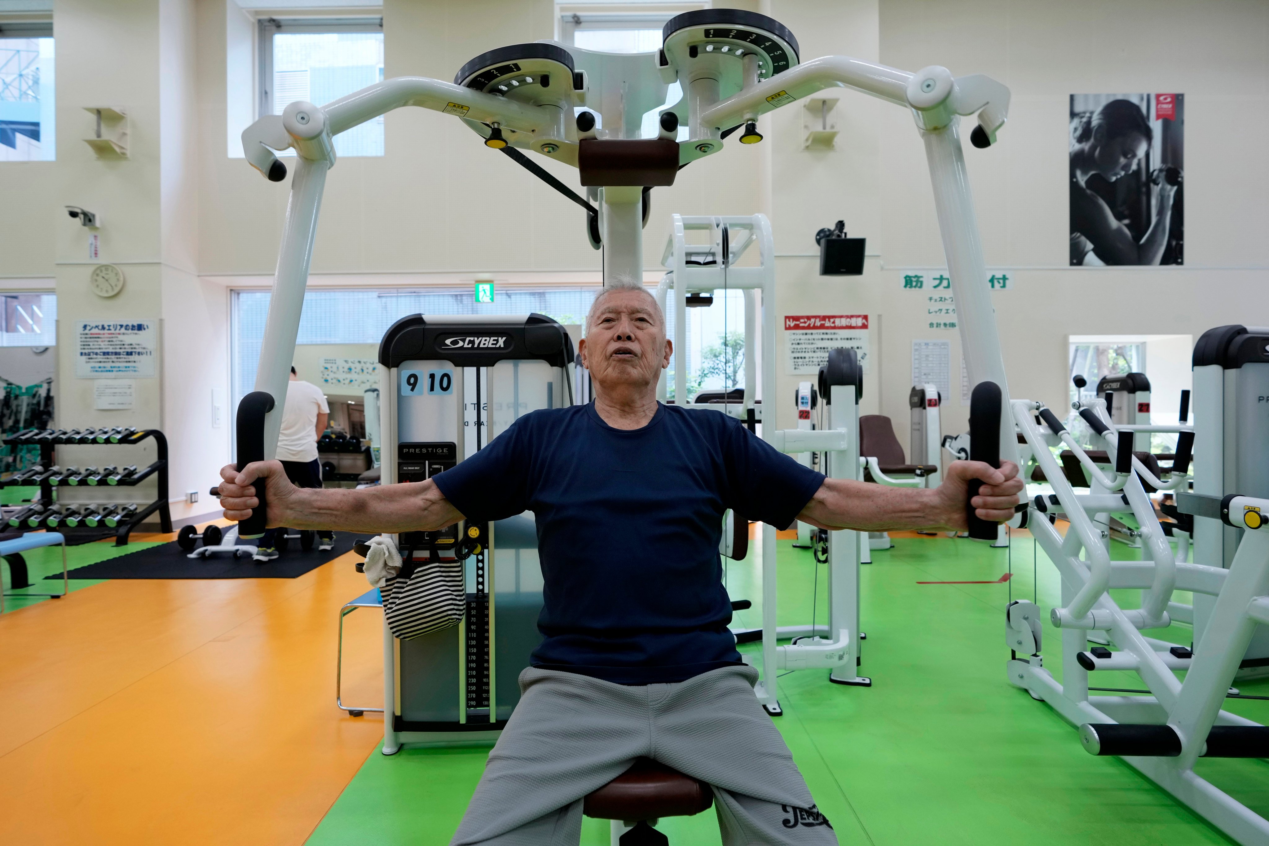 Shigeo Takahashi, 83, uses a pec deck machine as he works out at the Fukagawa Sports Centre in Tokyo, Japan. Photo: AP
