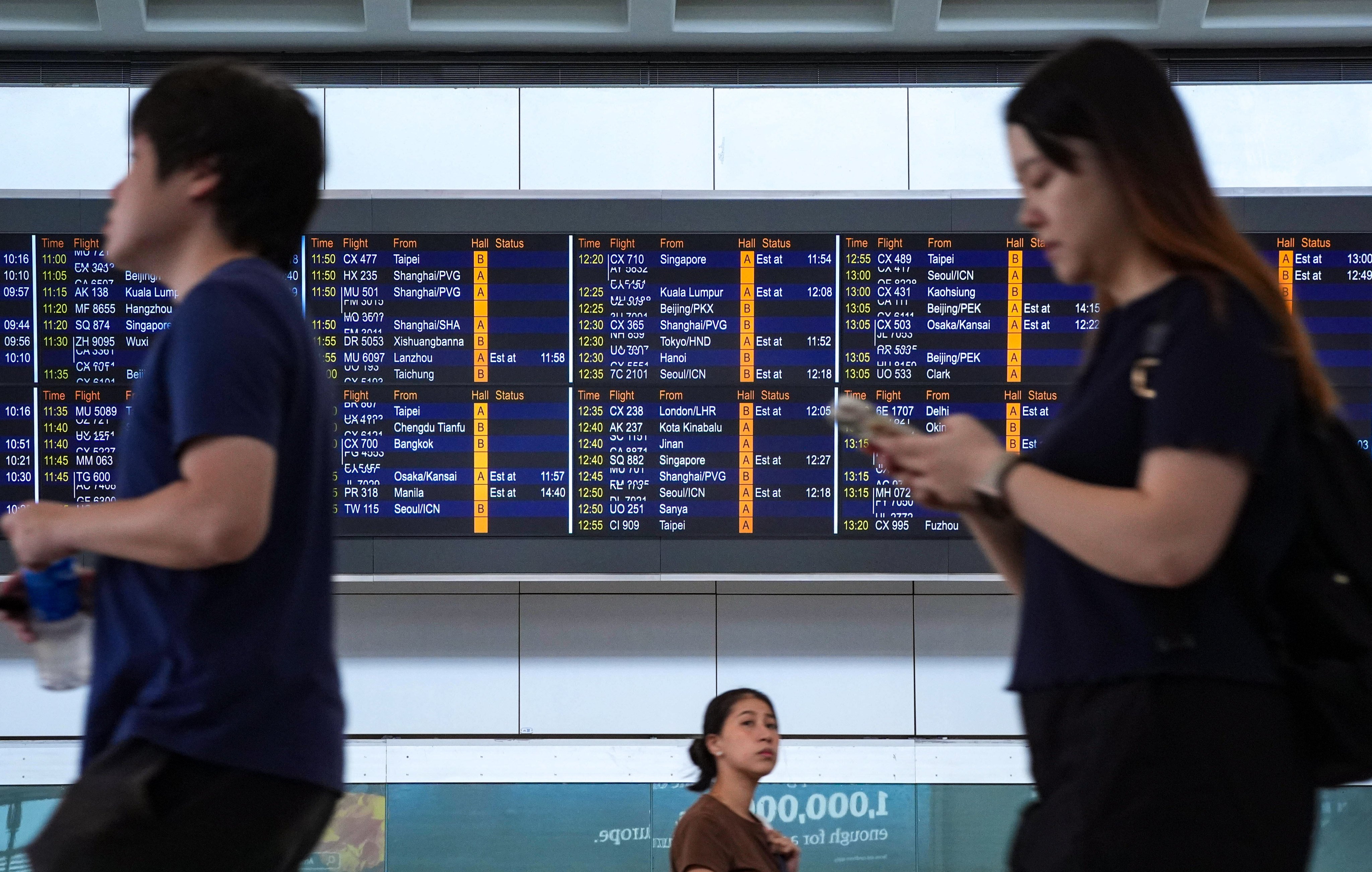 Airport passenger information screens were back online on Monday morning. Photo: Eugene Lee