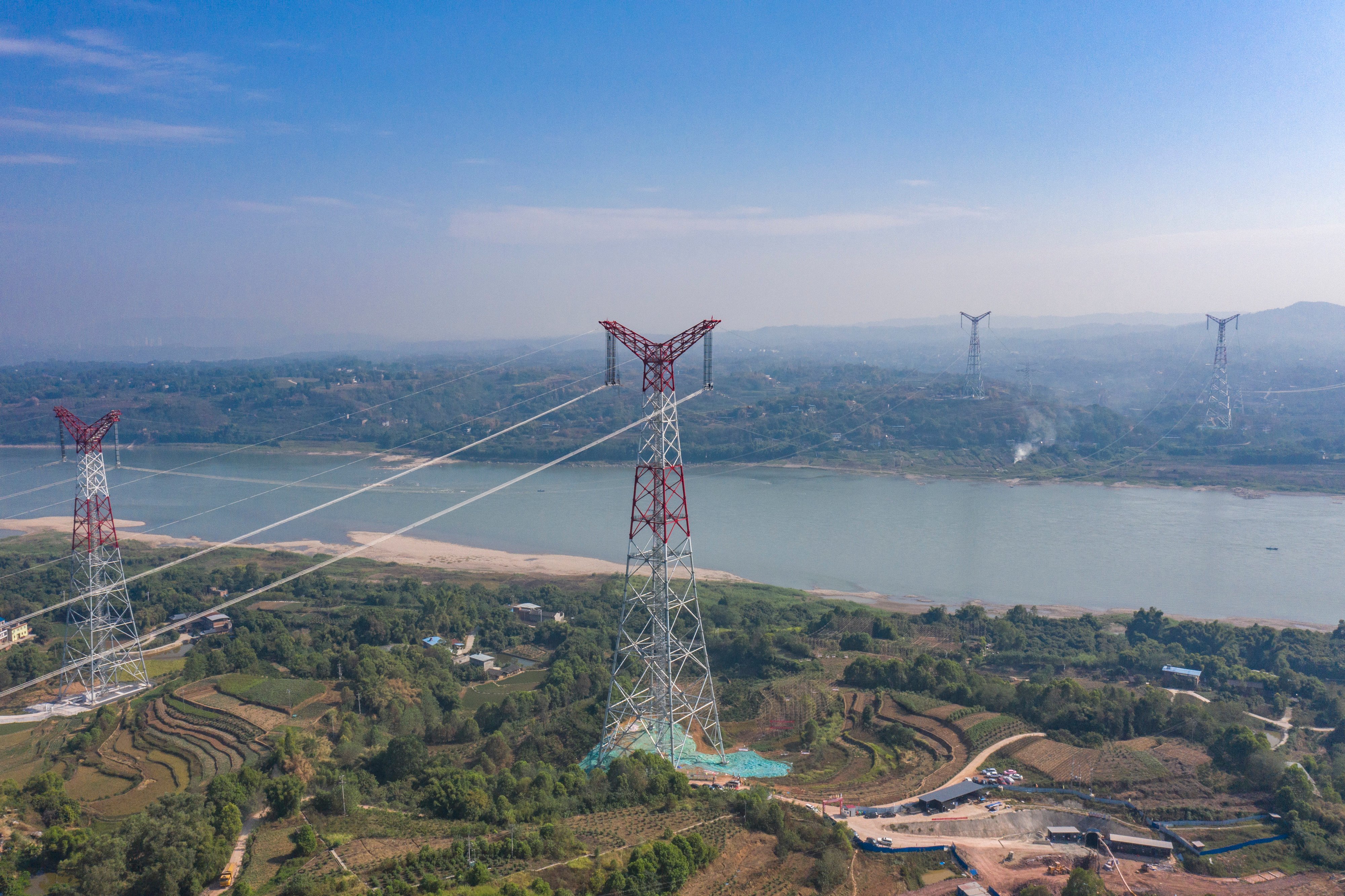 An aerial photo taken on September 13, 2022, shows part of the Baihetan-Zhejiang ultra-high-voltage transmission line project crossing the Yangtze River in southwest China’s Chongqing. Photo: Xinhua