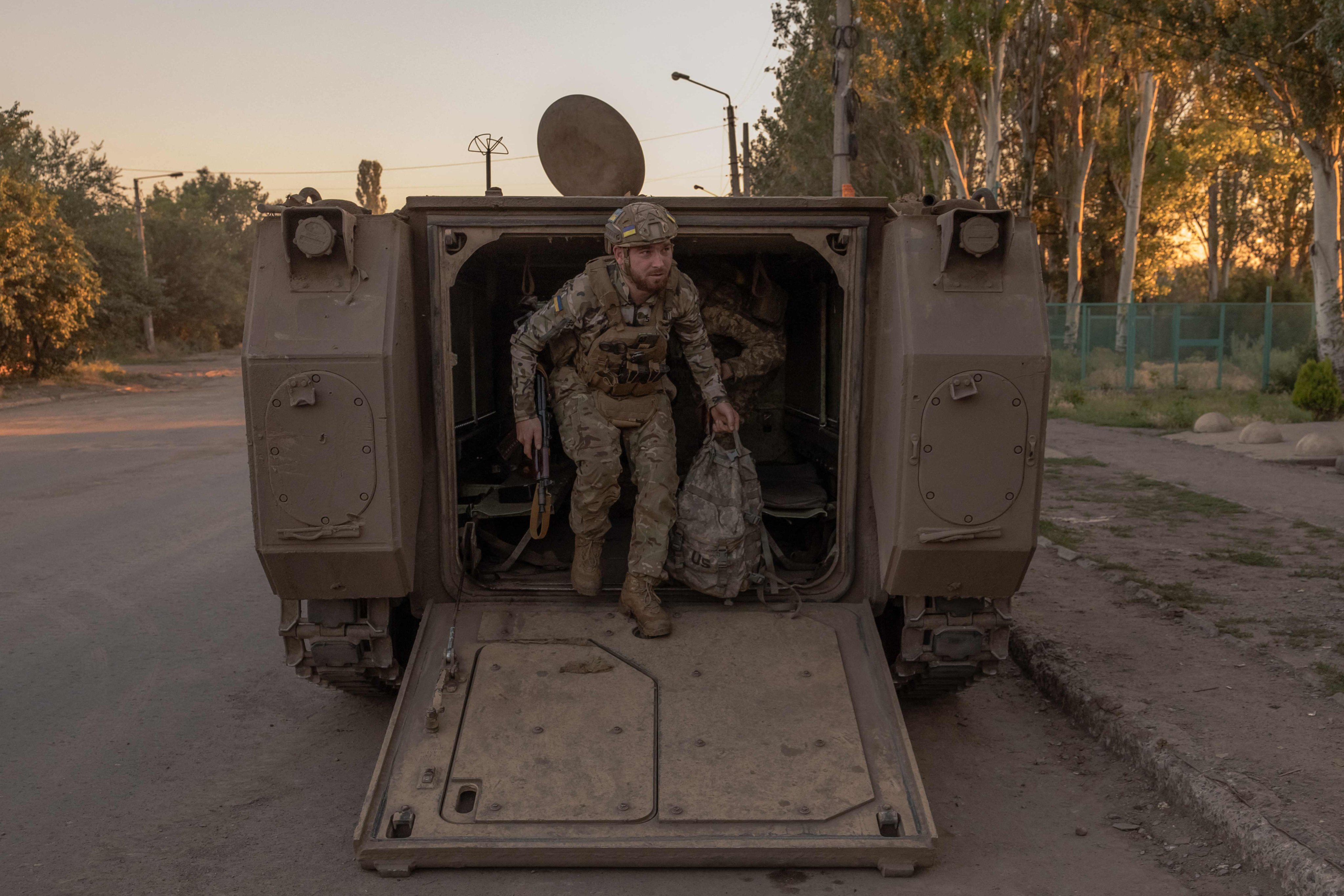 A Ukrainian soldier disembarks from a US-made M113 armoured personnel carrier. Photo: AFP