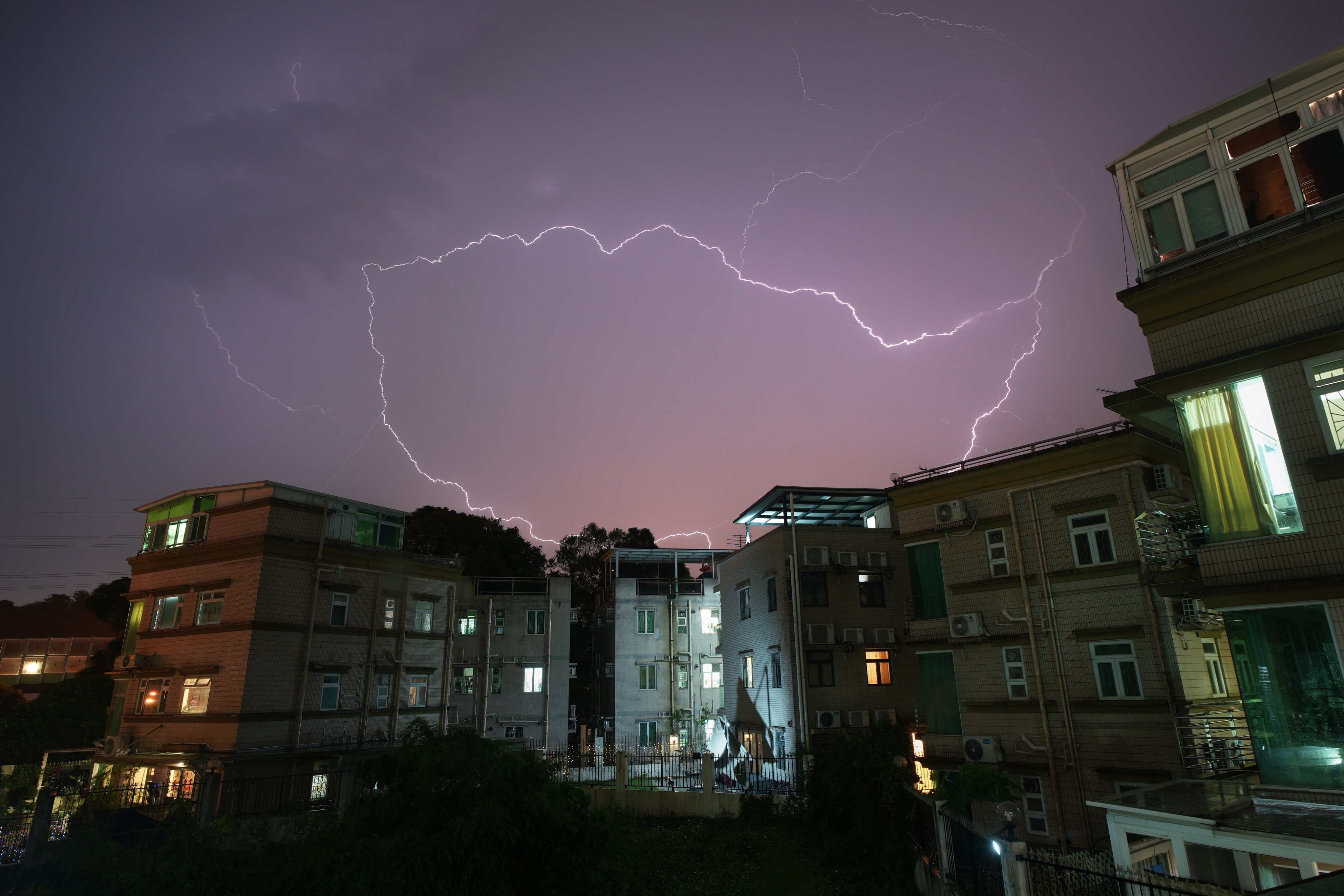 Lightning strikes a residential area in Lam Tsuen, Tai Po. Hong Kong is anticipating a hotter-than-usual summer with the possibility of up to eight typhoons between June and October. Photo: Eugene Lee
