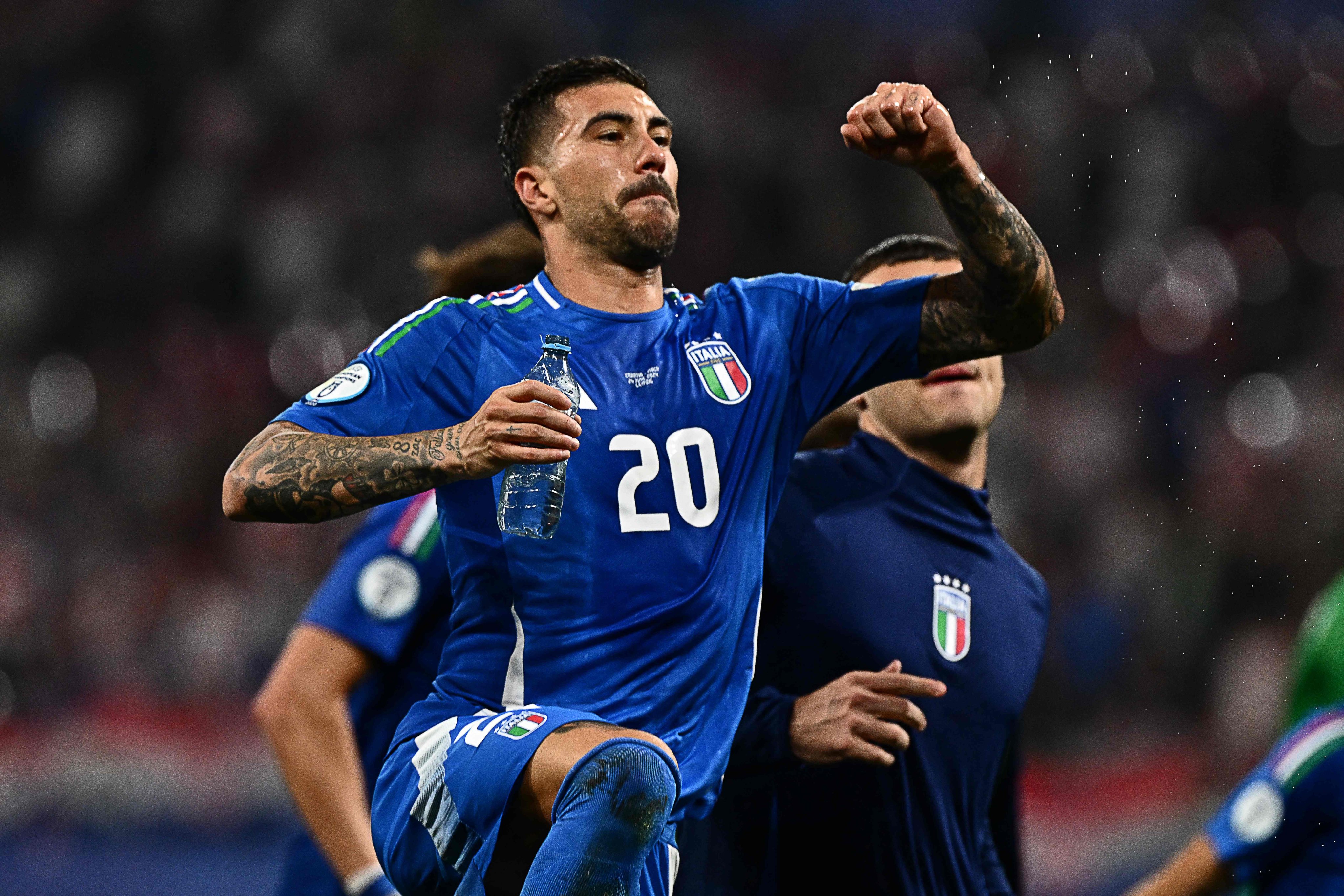 Italy forward Mattia Zaccagni is jubilant at full-time in Leipzig after his crucial late goal. Photo: AFP