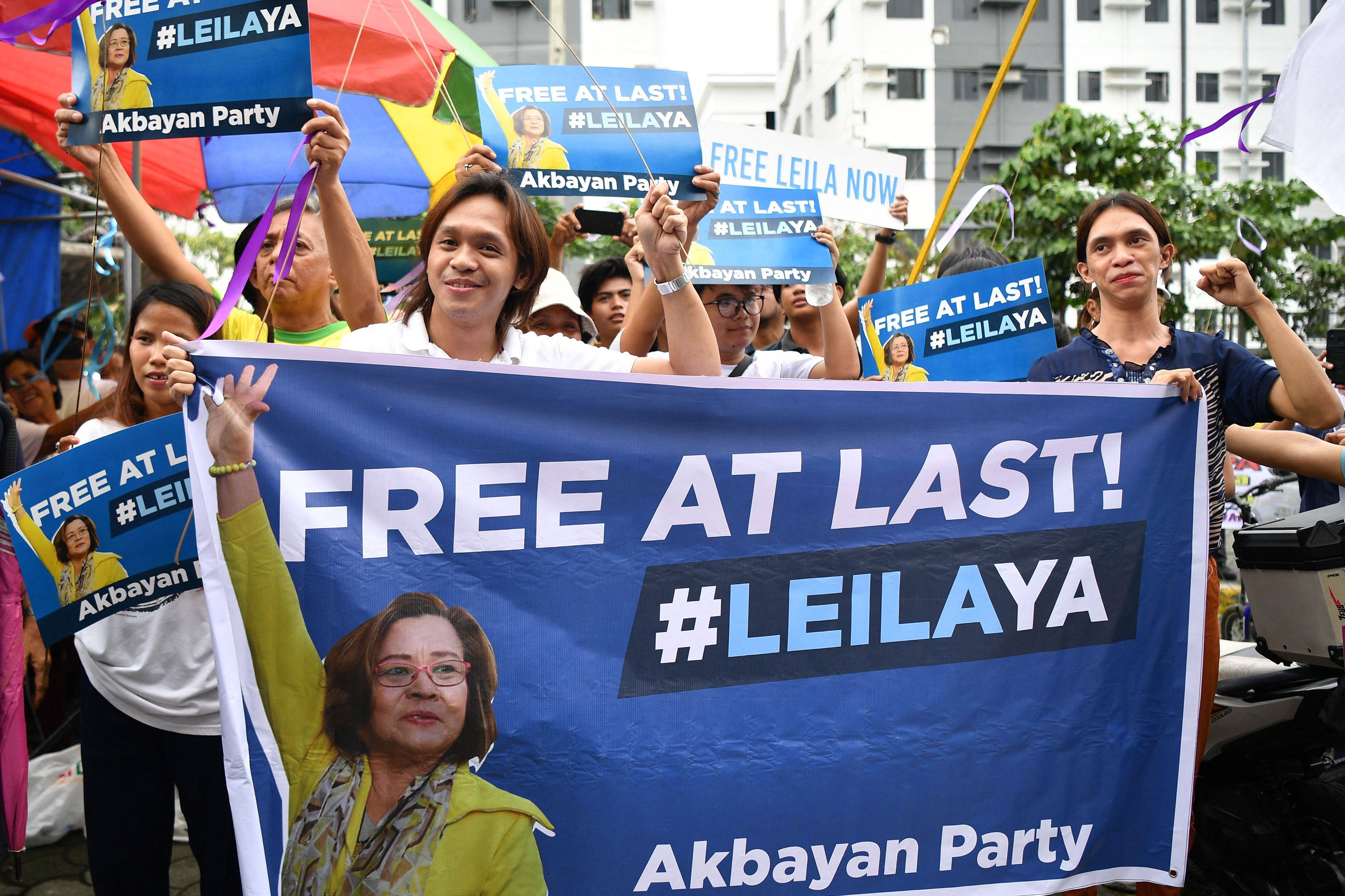 Supporters of Leila de Lima celebrate outside court after she was granted bail following nearly seven years behind bars. Photo: AFP