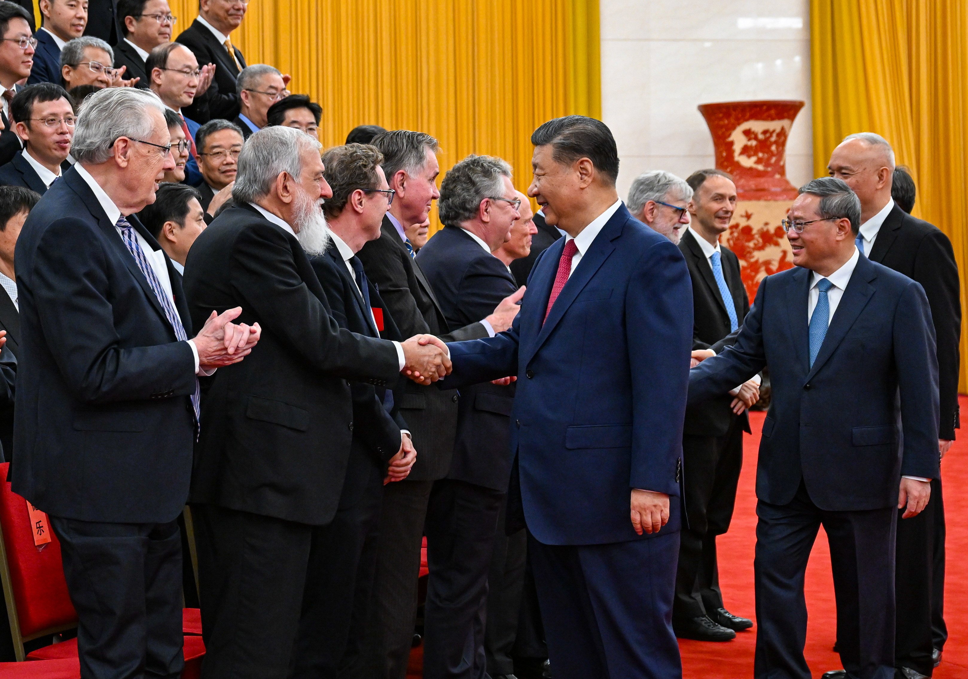 President Xi Jinping and other Politburo Standing Committee members meet representatives of the science award winners at the Great Hall of the People in Beijing on Monday. Photo: Xinhua